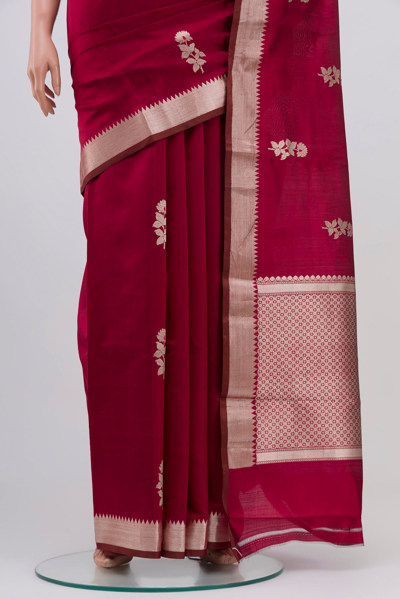 Pleats and pallu of Maroon Banarasi Katan Silk Saree with Zari Butta on the body and Zari Border. 