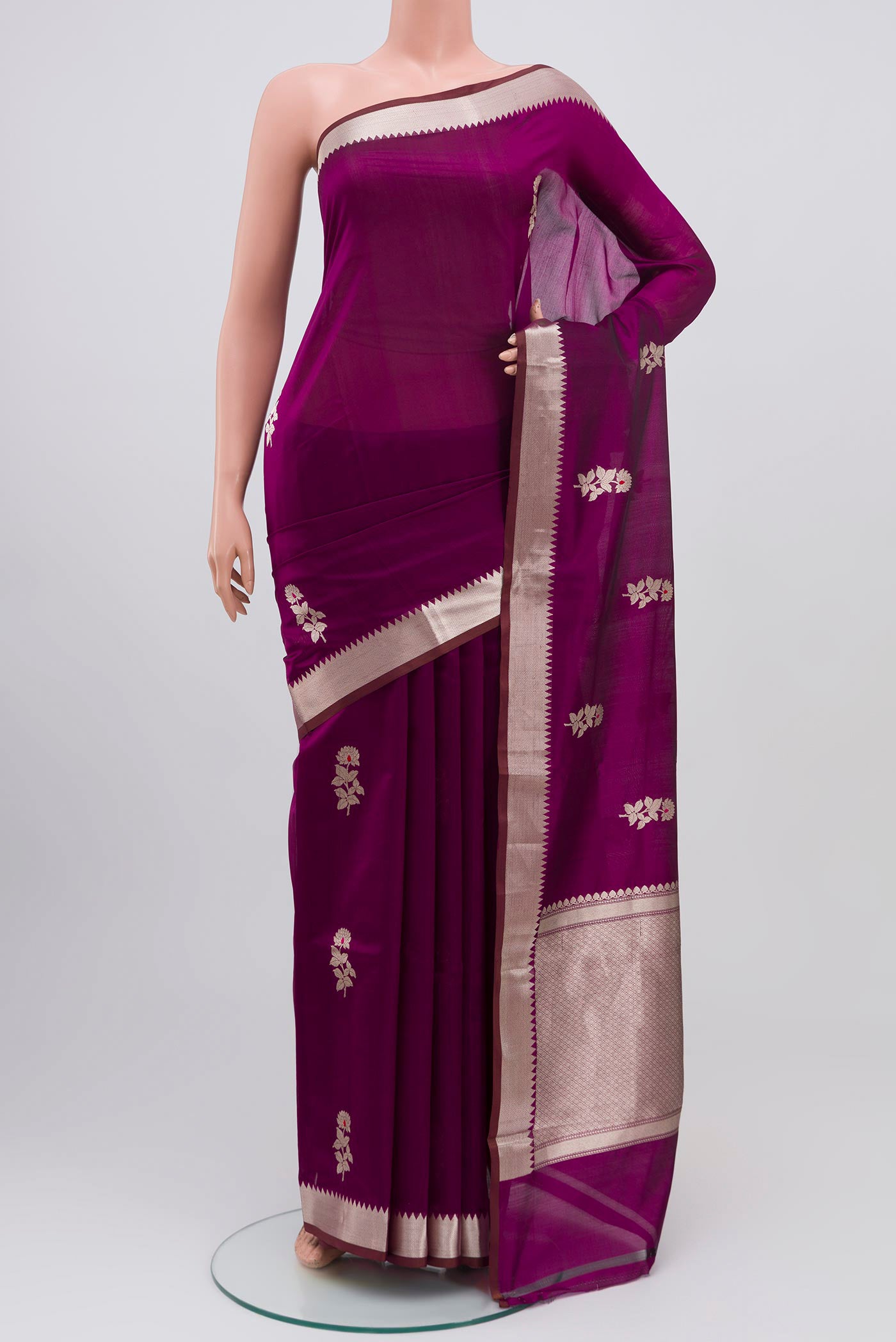 Purple Banarasi Katan Silk Saree with Zari Butta on the body and Zari Border.  displayed on a mannequin