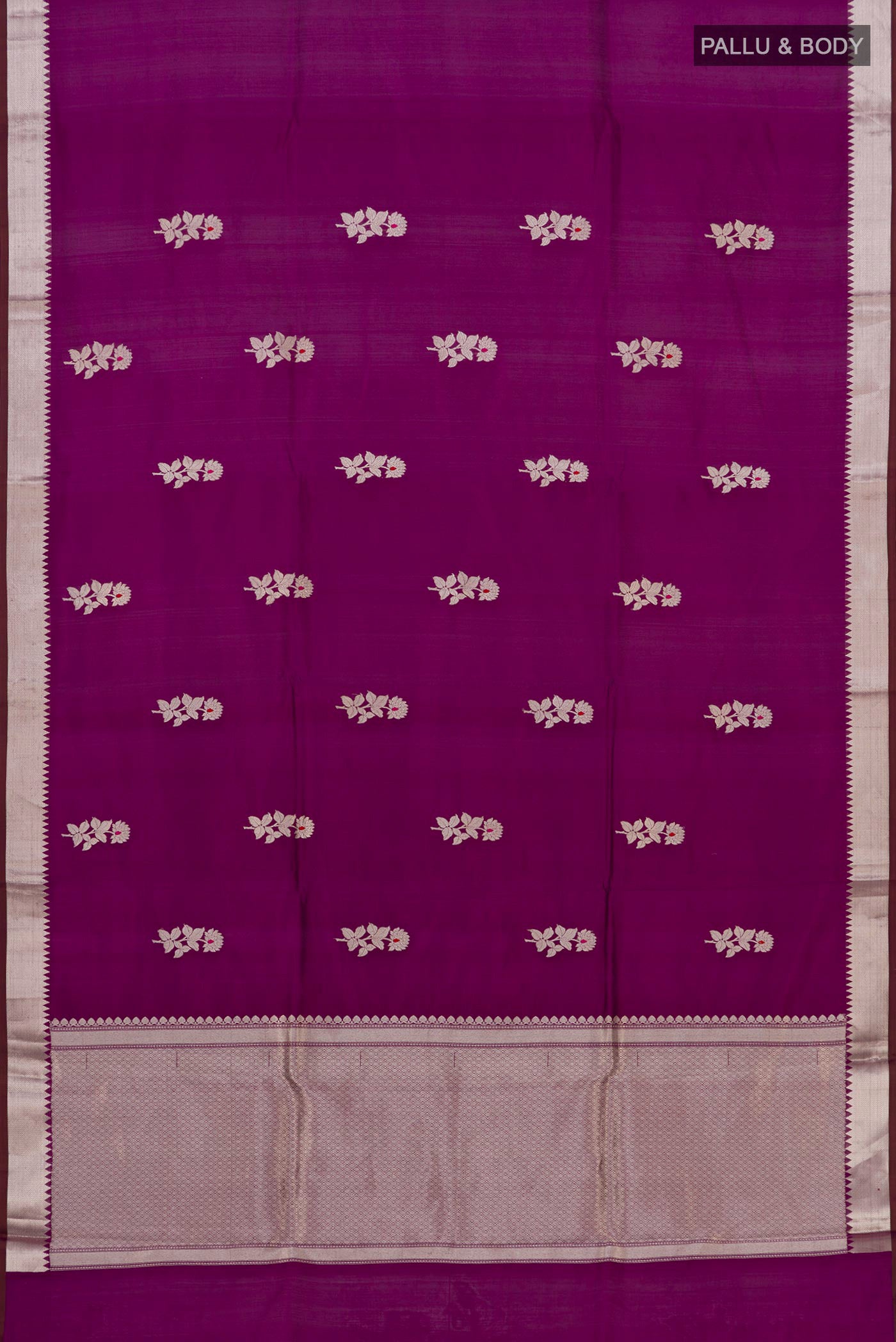 Flat view of Purple Banarasi Katan Silk Saree with Zari Butta on the body and Zari Border. 