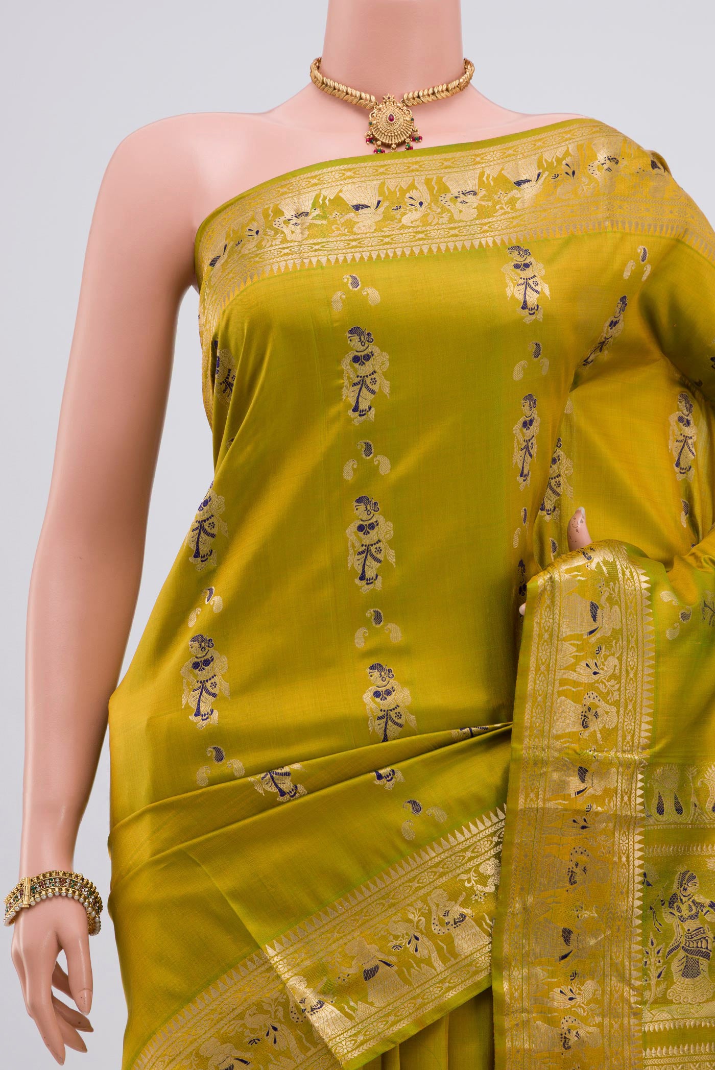 Border image of Green Baluchari Silk Saree with Zari Butta on the body and Zari Border. 