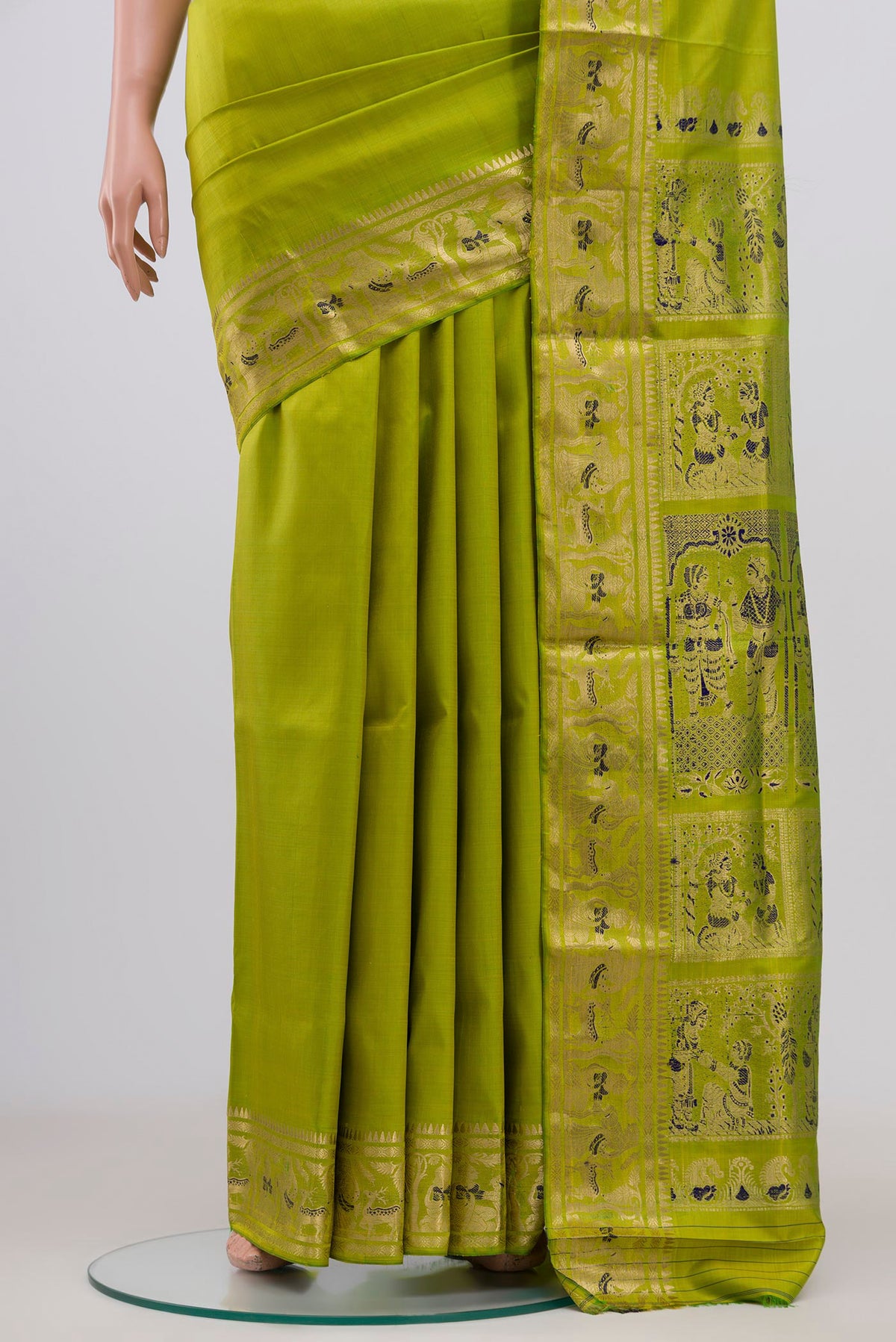 Pleats and pallu of Green Baluchari Silk Saree with Zari Butta on the body and Zari Border. 