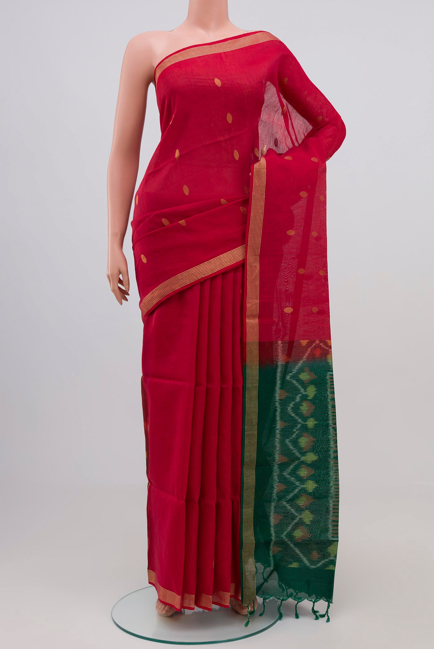 Red Coimbatore Silk Cotton Saree with Zari Butta on the body and Zari Border.  displayed on a mannequin