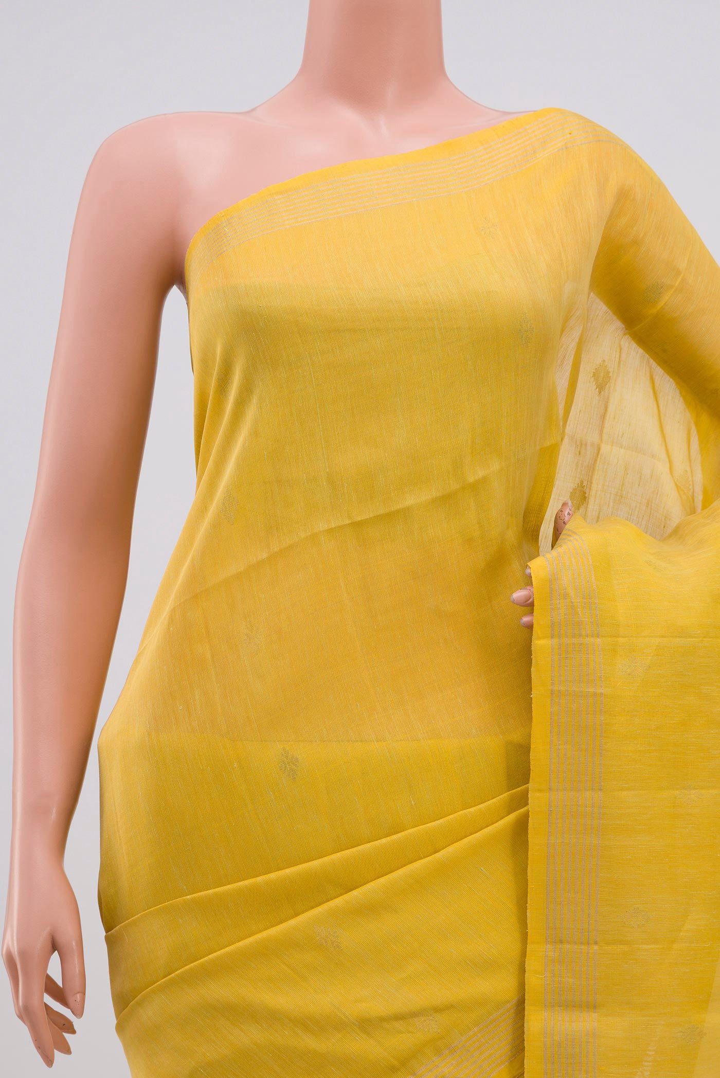 Border image of Yellow Soft Silk Saree with Zari Butta on the body and Thin Zari Line. 