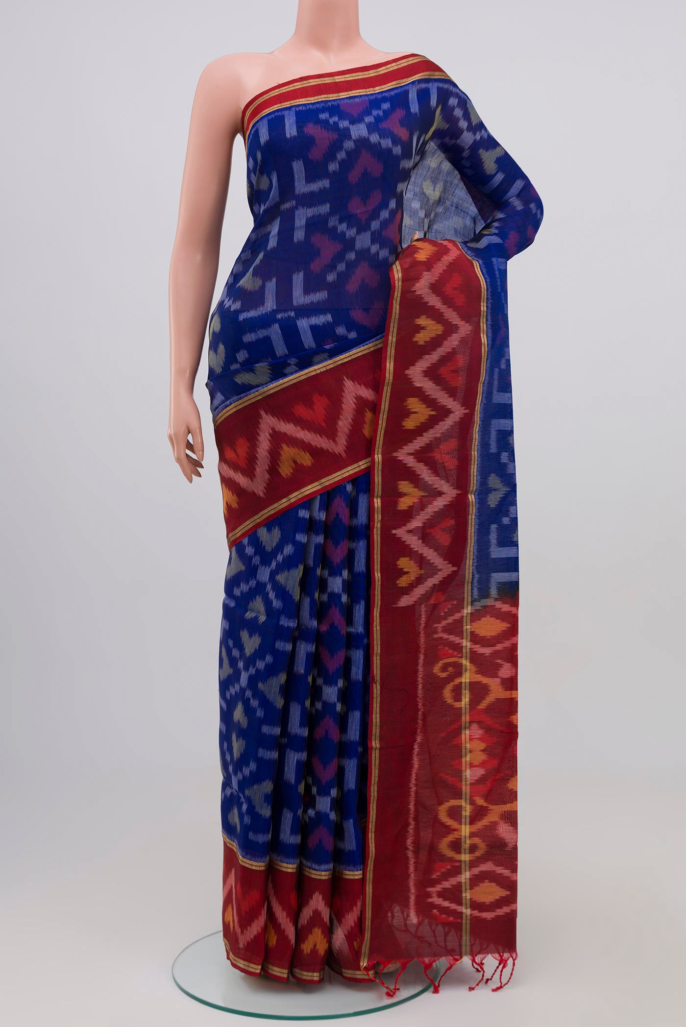 Blue Coimbatore Silk Cotton Saree with Ikat Print on the body and Zari Border.  displayed on a mannequin