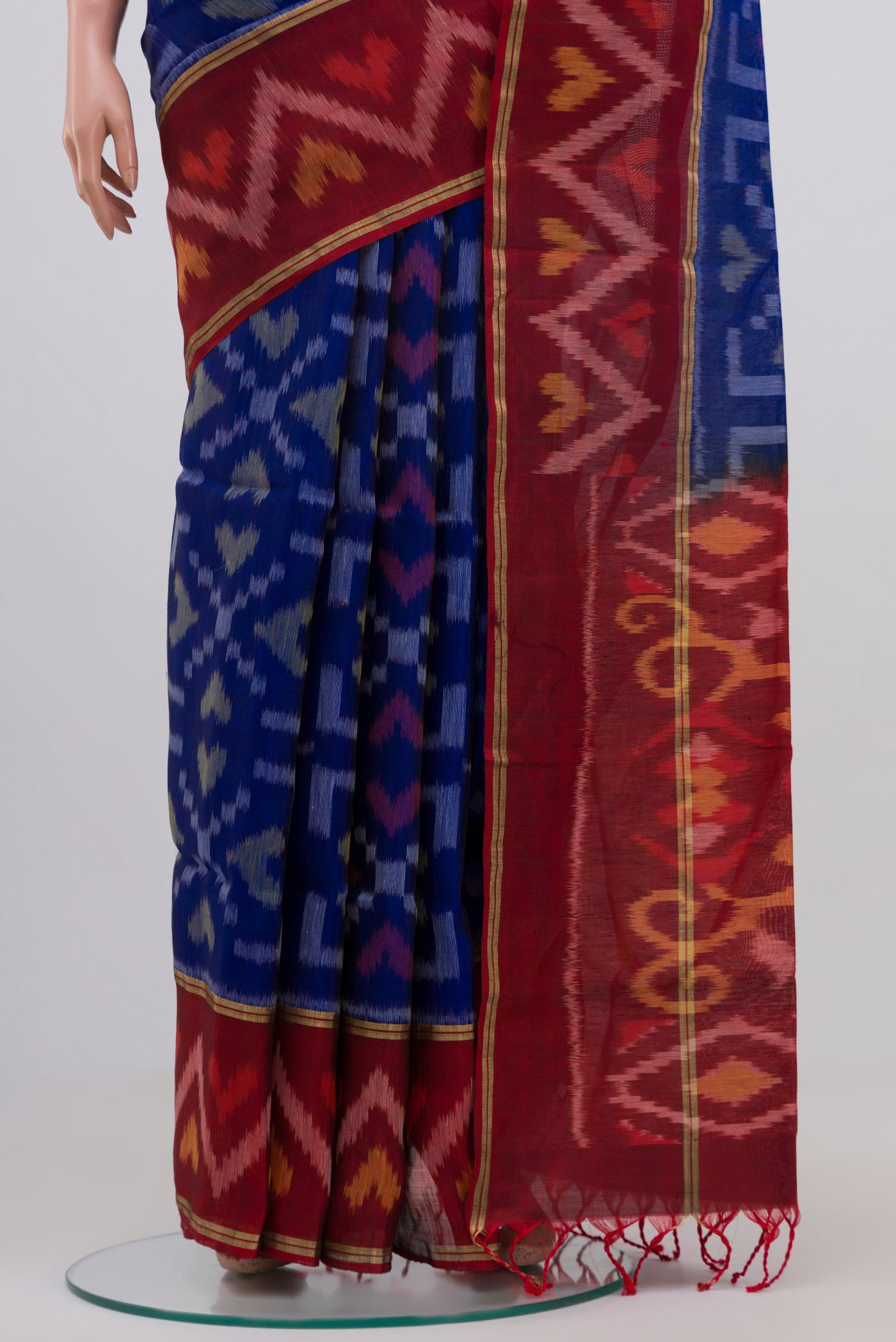 Pleats and pallu of Blue Coimbatore Silk Cotton Saree with Ikat Print on the body and Zari Border. 