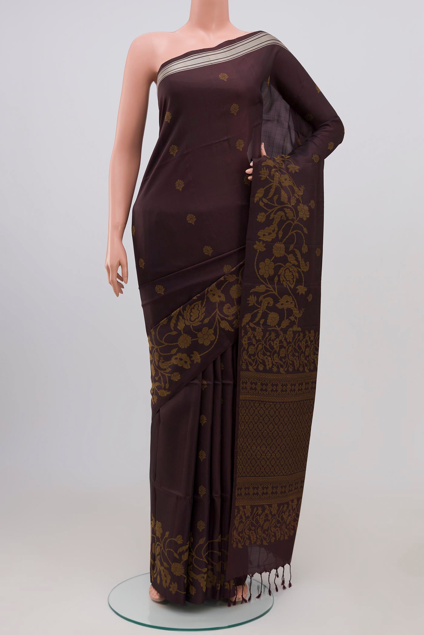 Brown Soft Silk Saree with Thread Butta on the body and Without Border.  displayed on a mannequin