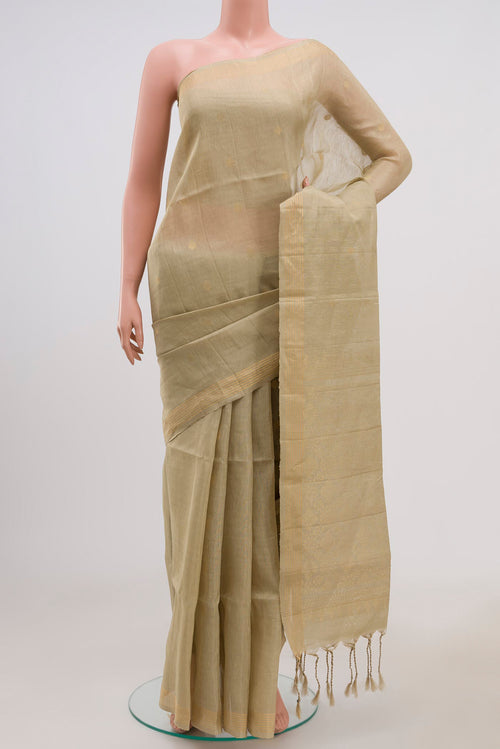 Beige Soft Silk Saree with Zari Butta on the body and Thin Zari Line.  displayed on a mannequin