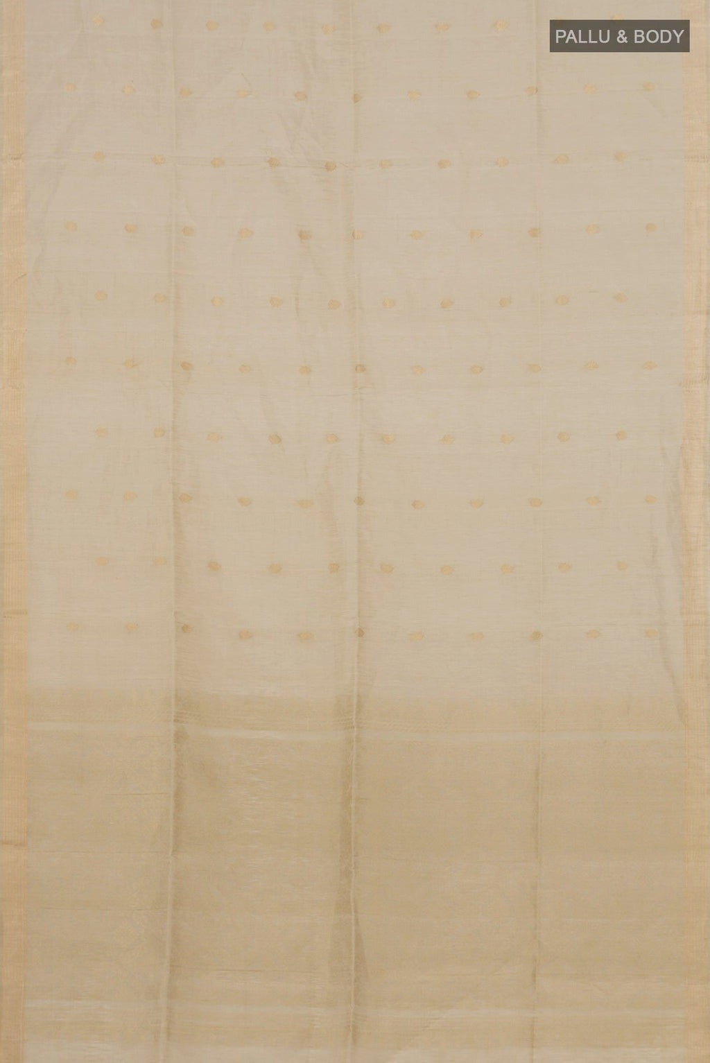 Flat view of Beige Soft Silk Saree with Zari Butta on the body and Thin Zari Line. 