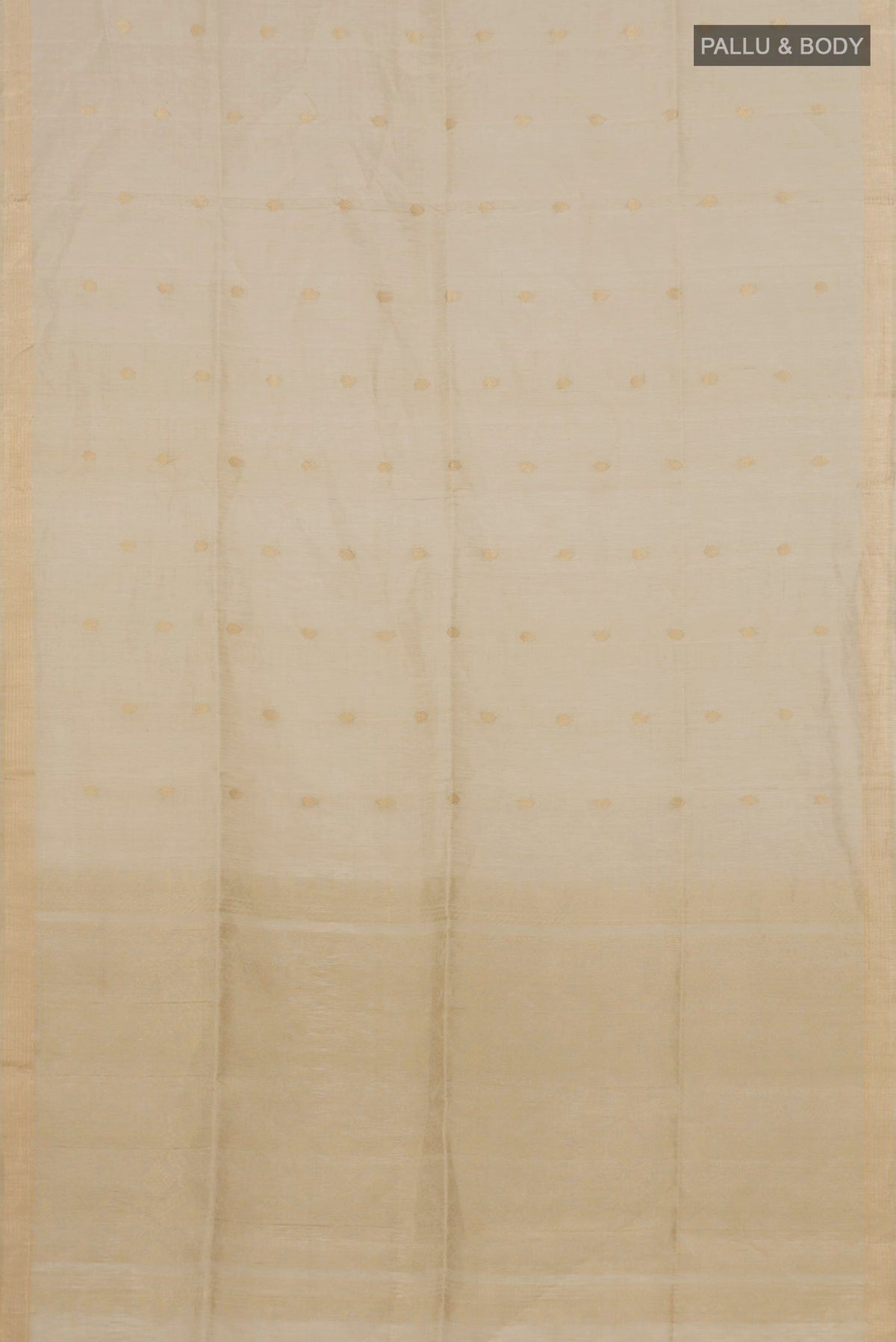Flat view of Beige Soft Silk Saree with Zari Butta on the body and Thin Zari Line. 