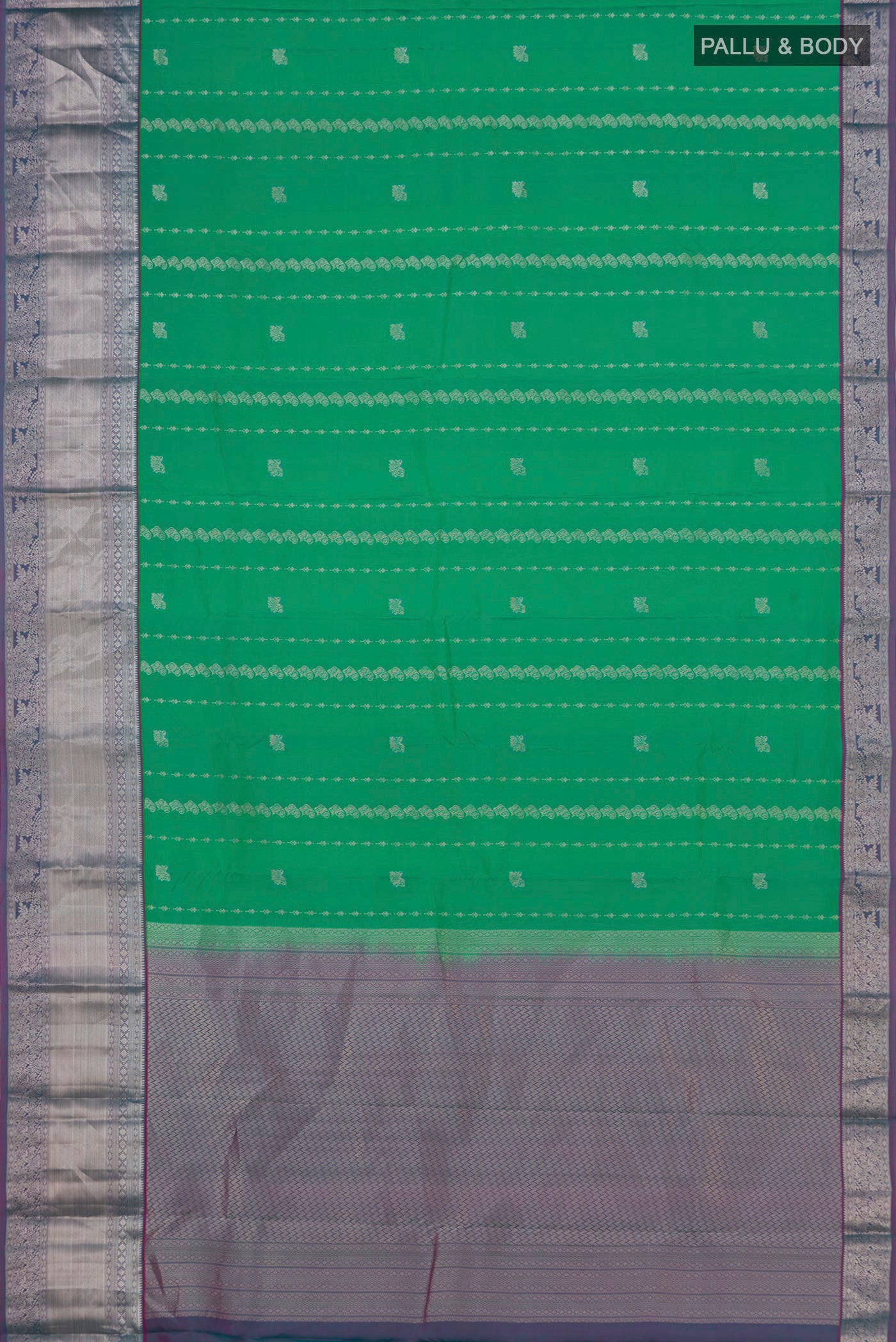 Flat view of Green Kanchipuram Silk Saree with Zari Butta on the body and Zari Border. 