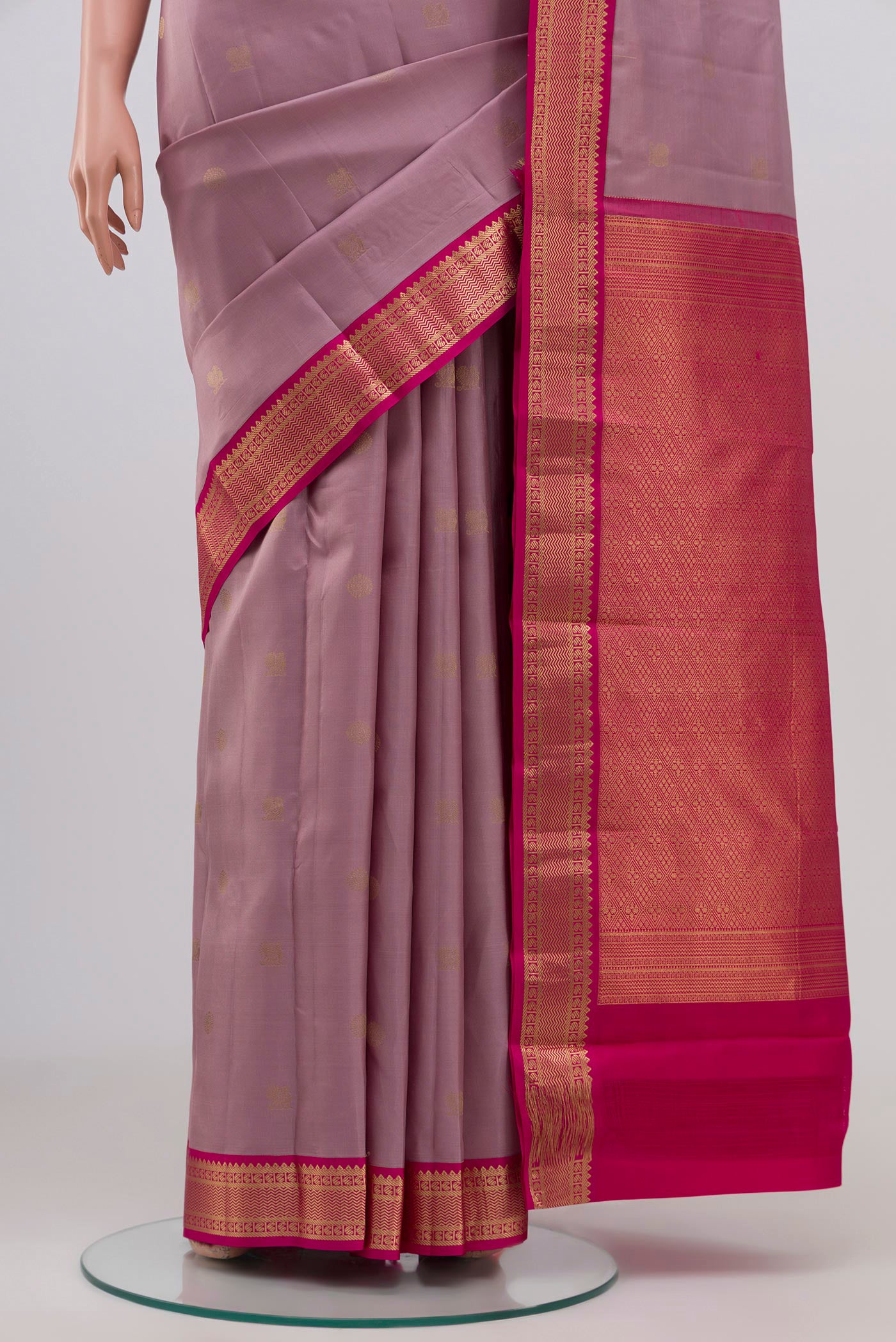 Pleats and pallu of Lavender Kanchipuram Silk Saree with Zari Butta on the body and Zari Border. 