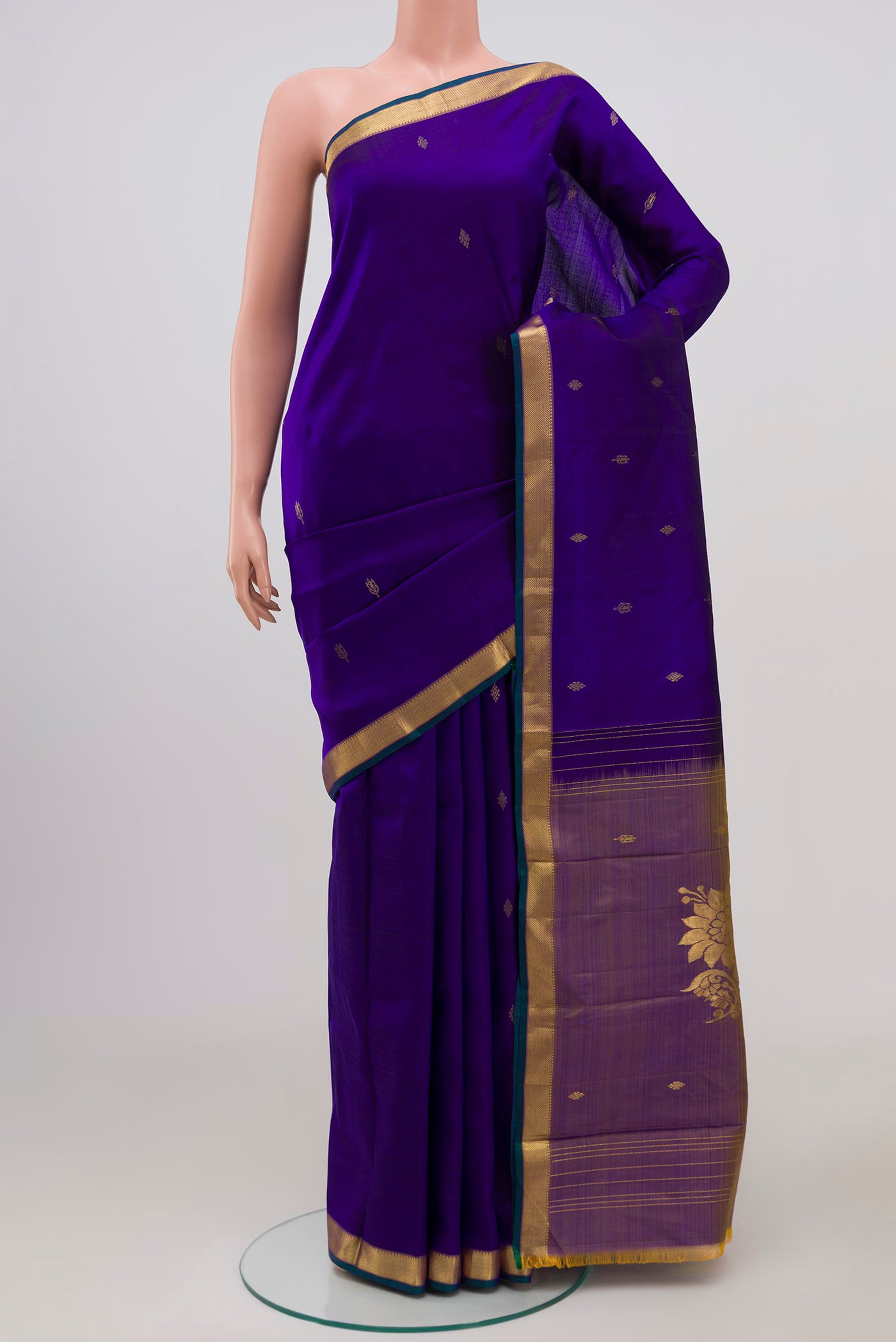 Pure Silk Pure Zari Navy Blue Kanchipuram Saree with Zari Butta on the body and Zari Border.  displayed on a mannequin