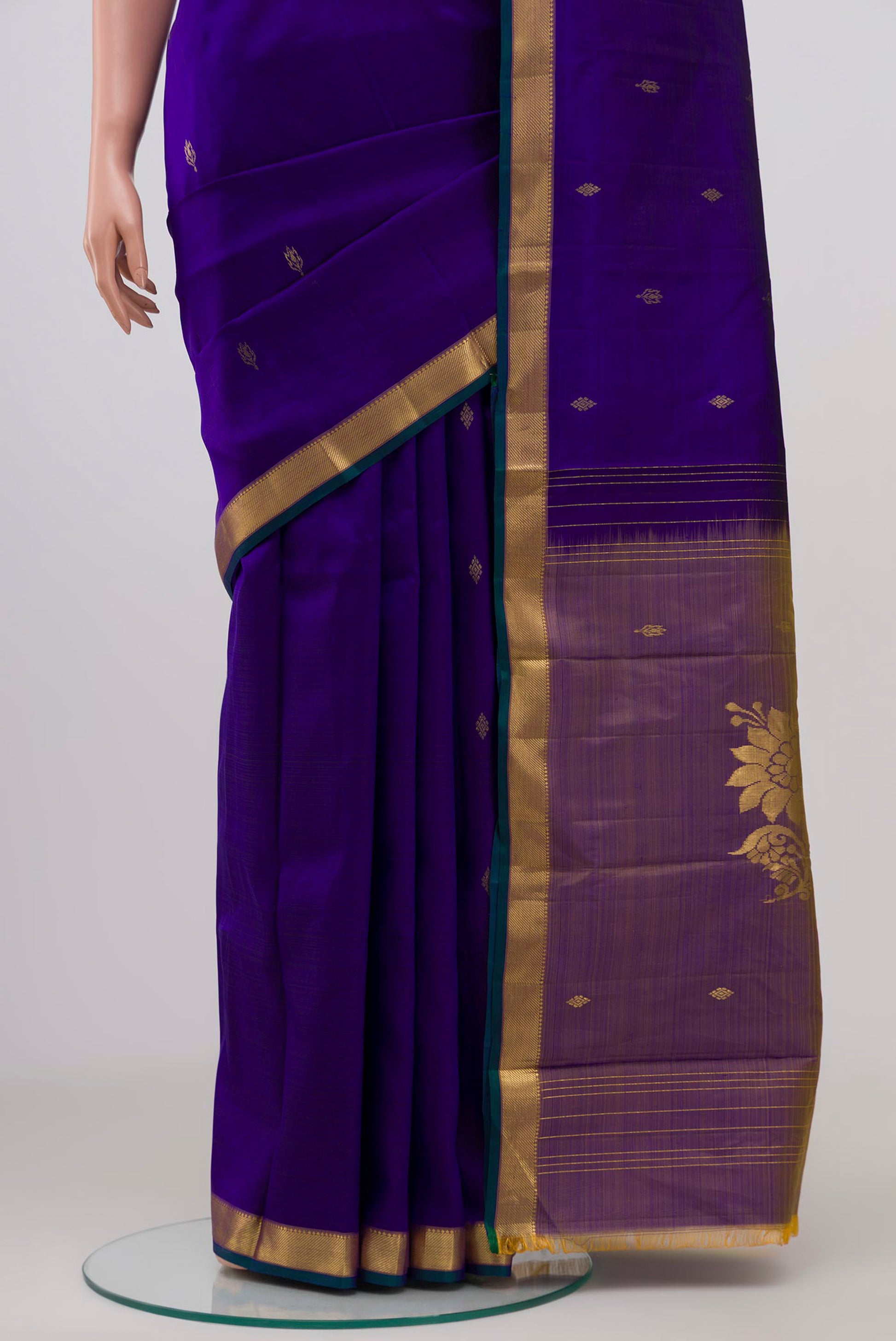 Pleats and pallu of Pure Silk Pure Zari Navy Blue Kanchipuram Saree with Zari Butta on the body and Zari Border. 