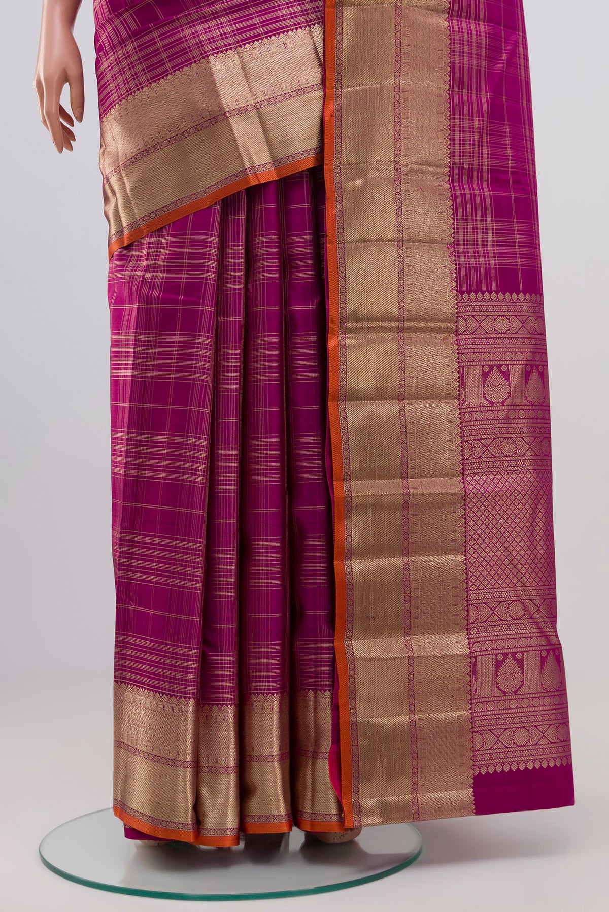 Pleats and pallu of Purple Kanchipuram Silk Saree with Checked design on the body and Zari Border. 