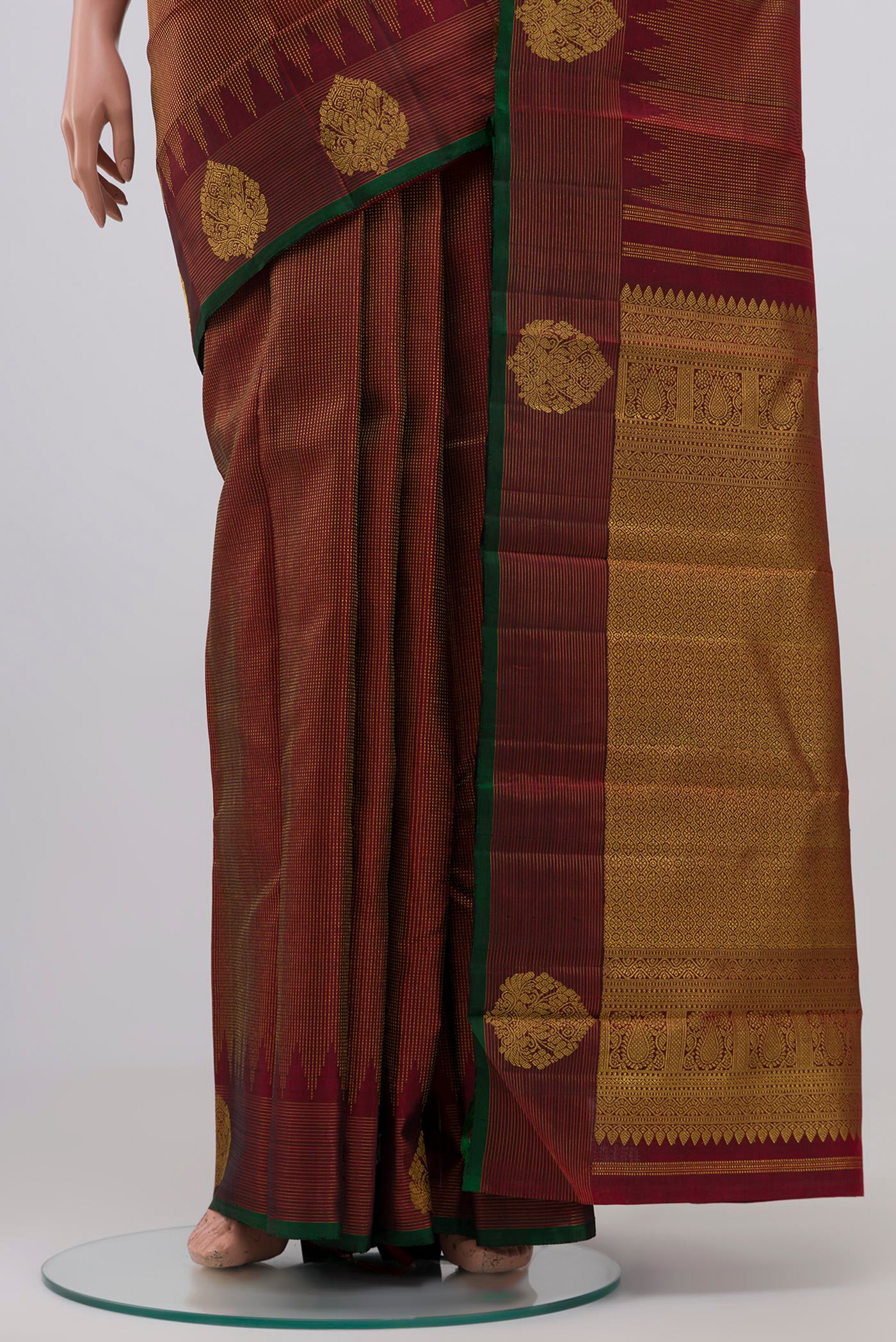 Pleats and pallu of Maroon Kanjivaram Silk Saree with Zari Brocade on the body and Zari Border. 