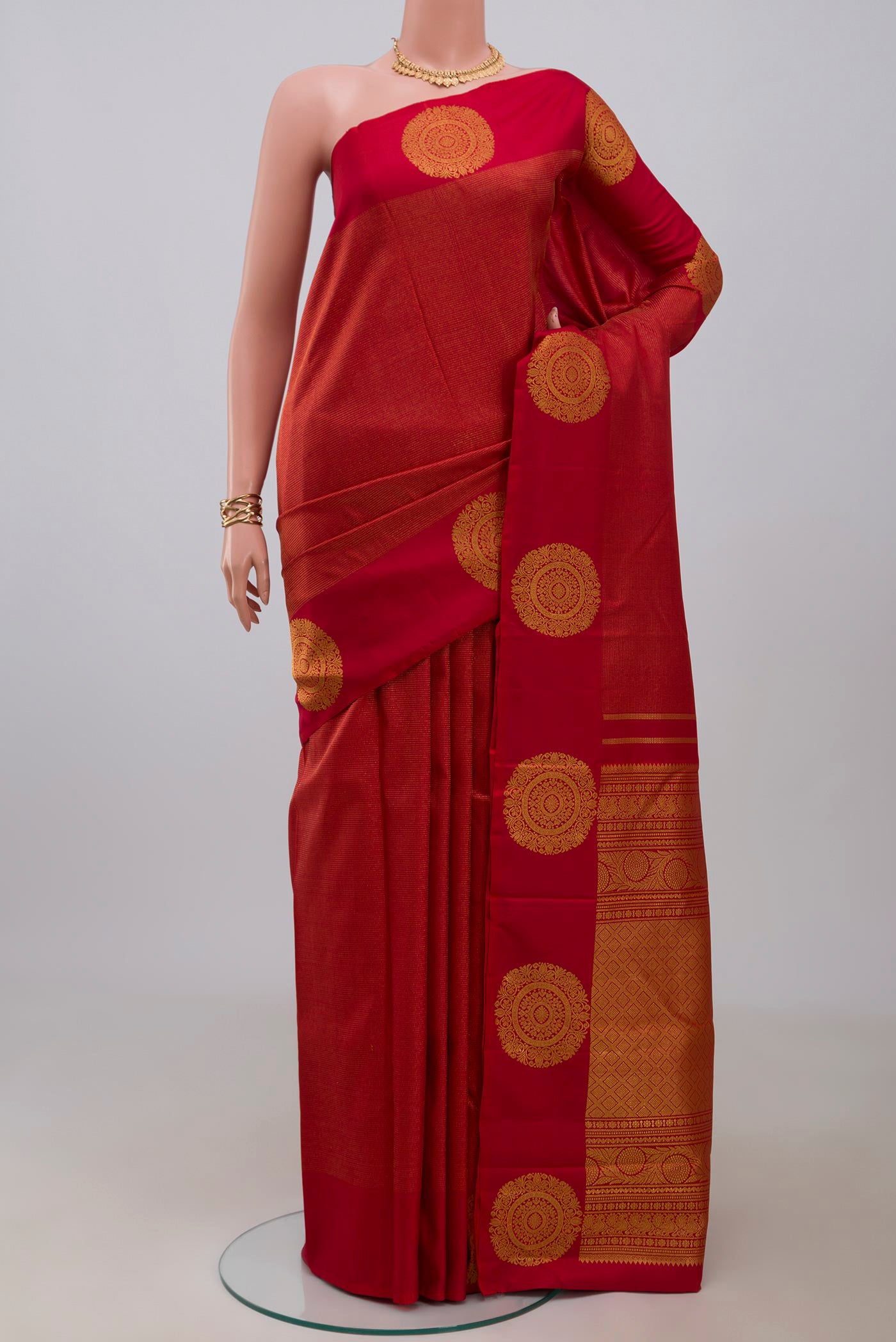 Red Kanjivaram Silk Saree with Stripes on the body and Fancy Border.  displayed on a mannequin