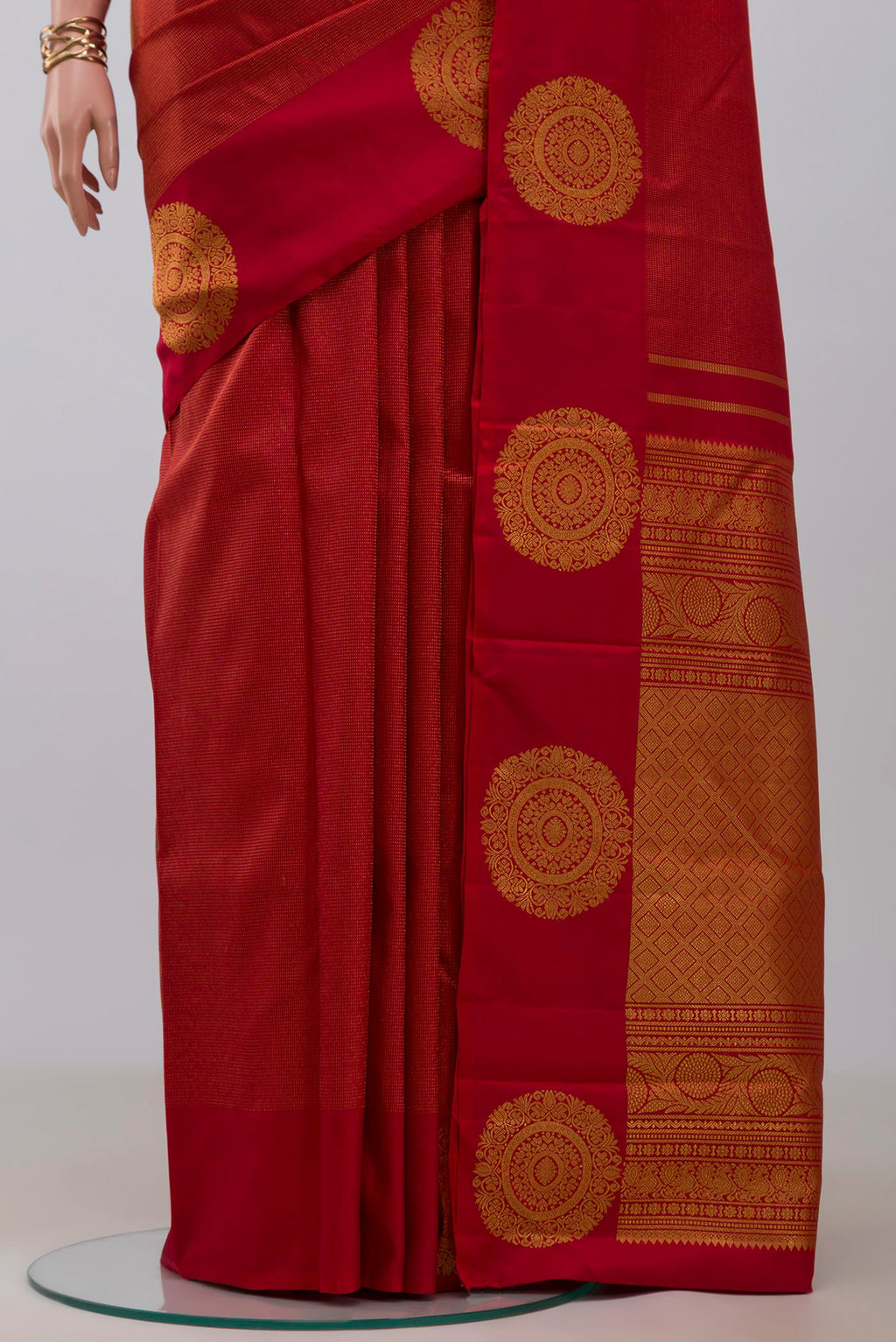 Pleats and pallu of Red Kanjivaram Silk Saree with Stripes on the body and Fancy Border. 