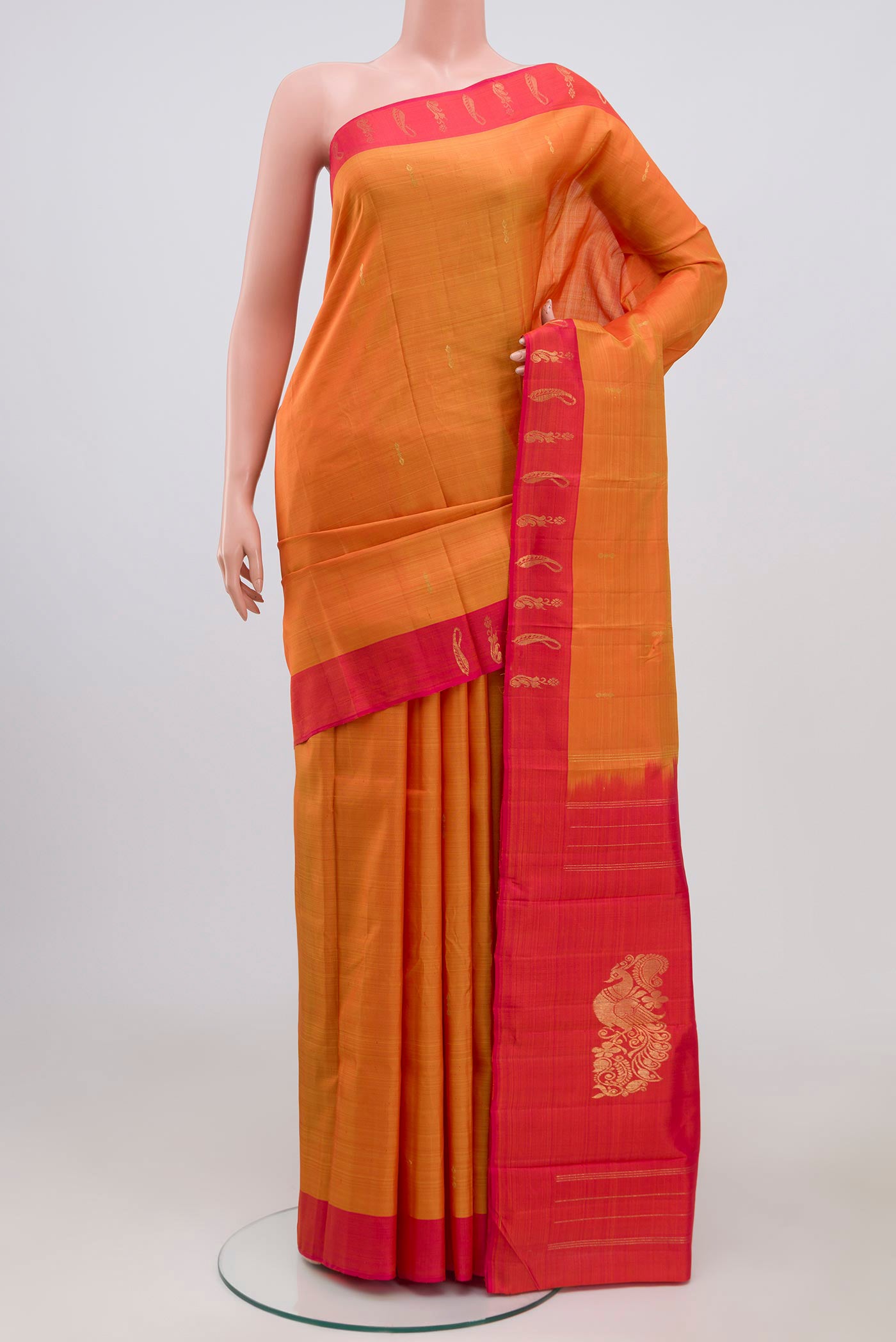 Pure Silk Pure Zari Yellow Kanchipuram Saree with Zari Butta on the body and Thin Zari Line.  displayed on a mannequin