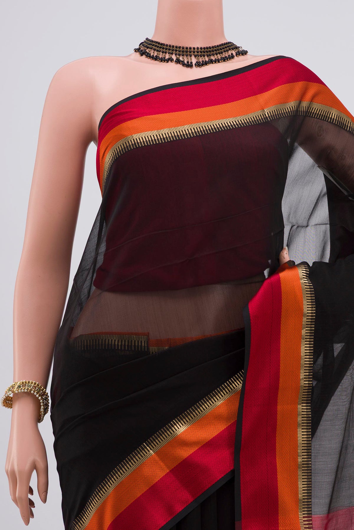 Border image of Black Maheshwari Silk Saree with Plain Body and Zari Border. 