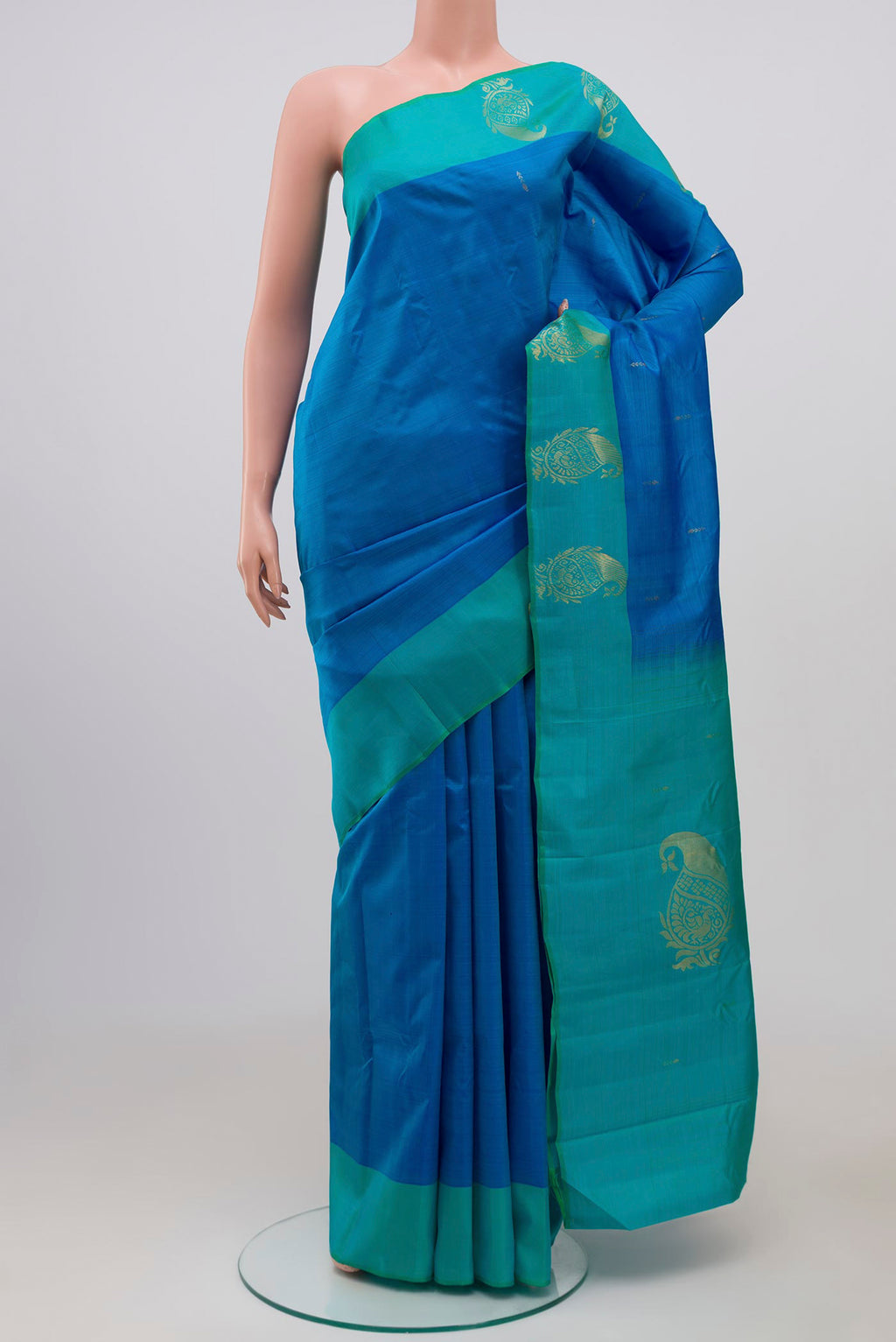 Pure Silk Pure Zari Blue Kanchipuram Saree with Zari Butta on the body and Fancy Border.  displayed on a mannequin