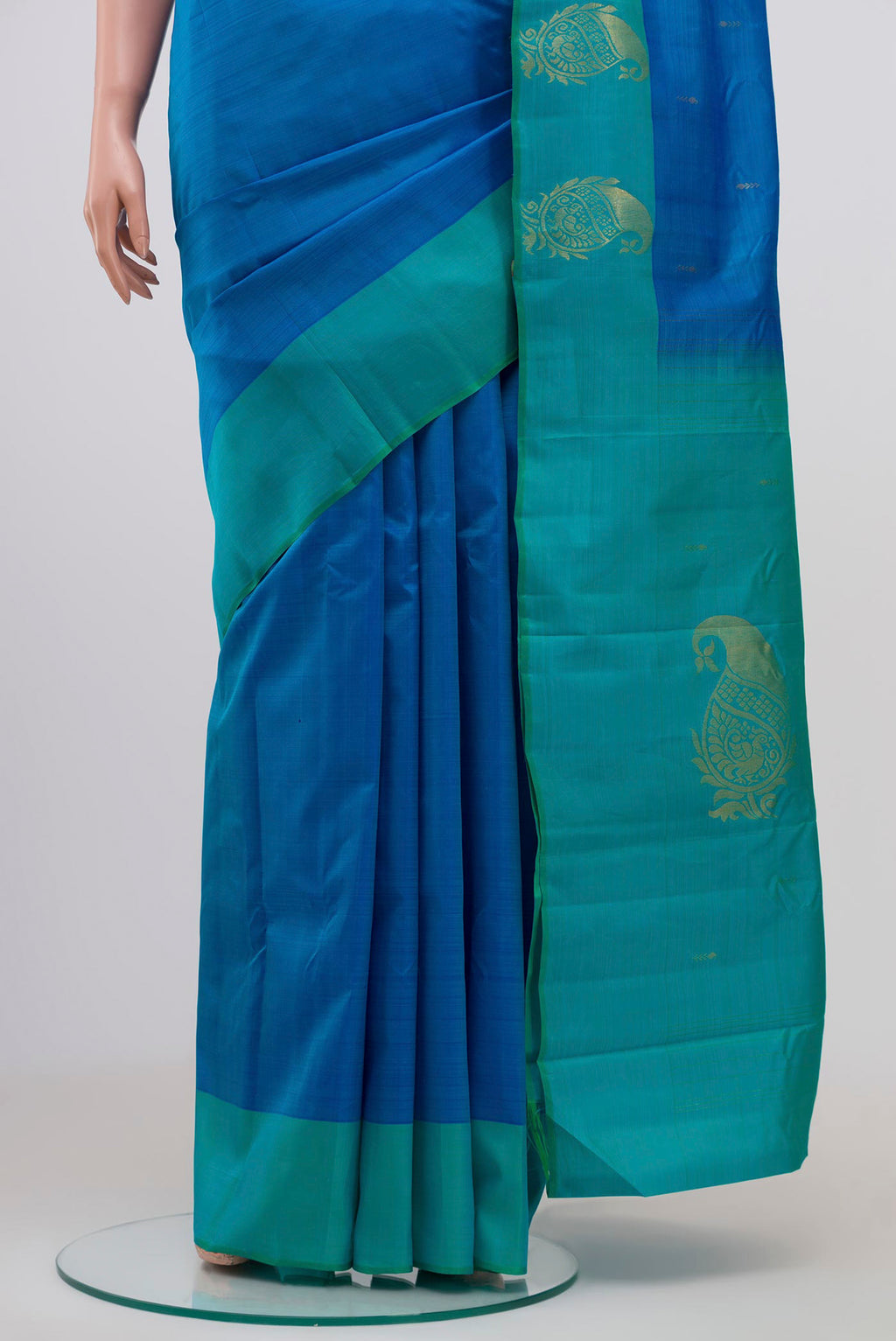 Pleats and pallu of Pure Silk Pure Zari Blue Kanchipuram Saree with Zari Butta on the body and Fancy Border. 