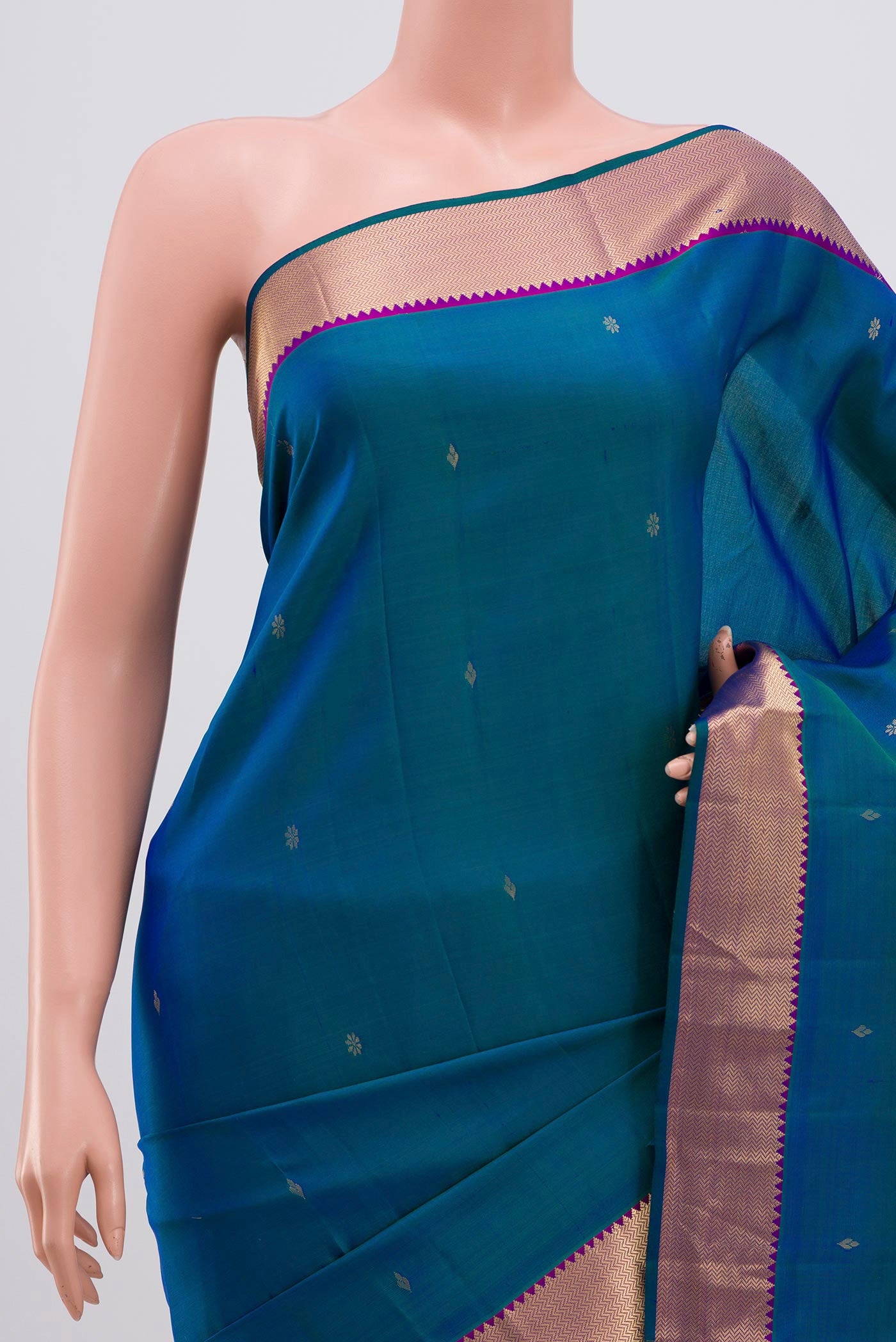 Border image of Peacock Blue Kanjivaram Silk Saree with Zari Butta on the body and Zari Border. 