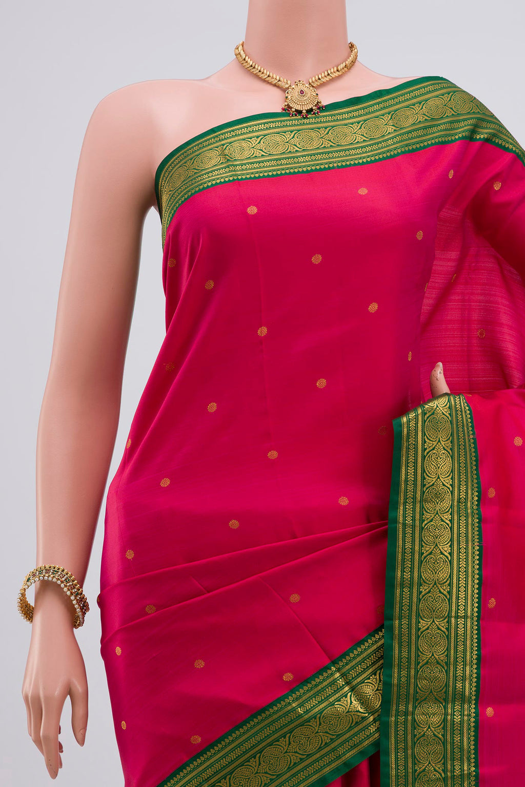 Border image of Rani Pink Kanjivaram Silk Saree with Zari Butta on the body and Zari Border. 