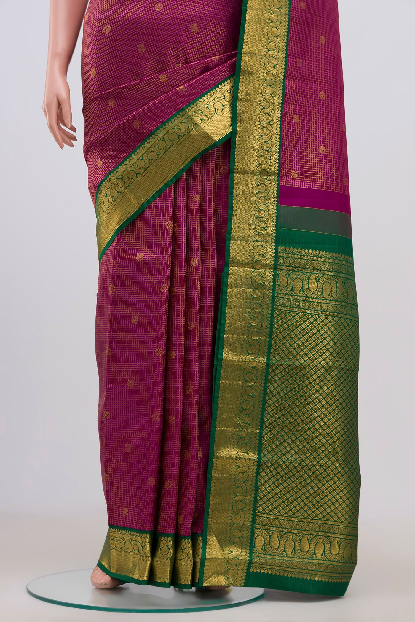 Pleats and pallu of Purple Kanjivaram Saree with Checked design on the body and Zari Border. 