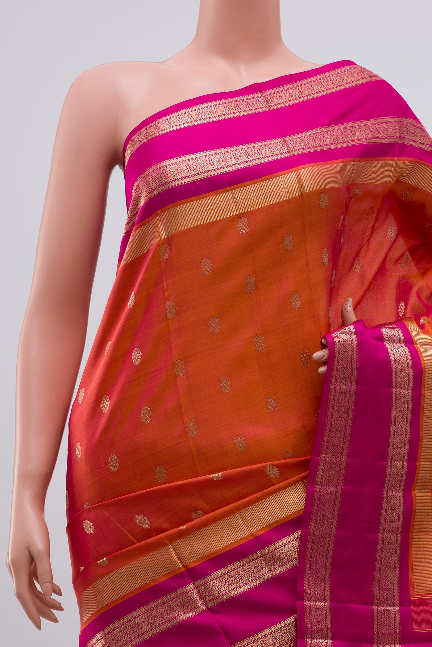Border image of Orange Kanjivaram Saree with Zari Butta on the body and Zari Border. 