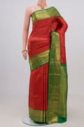 Red Kanchipuram Silk Saree with Zari Brocade on the body and Zari Border.  displayed on a mannequin