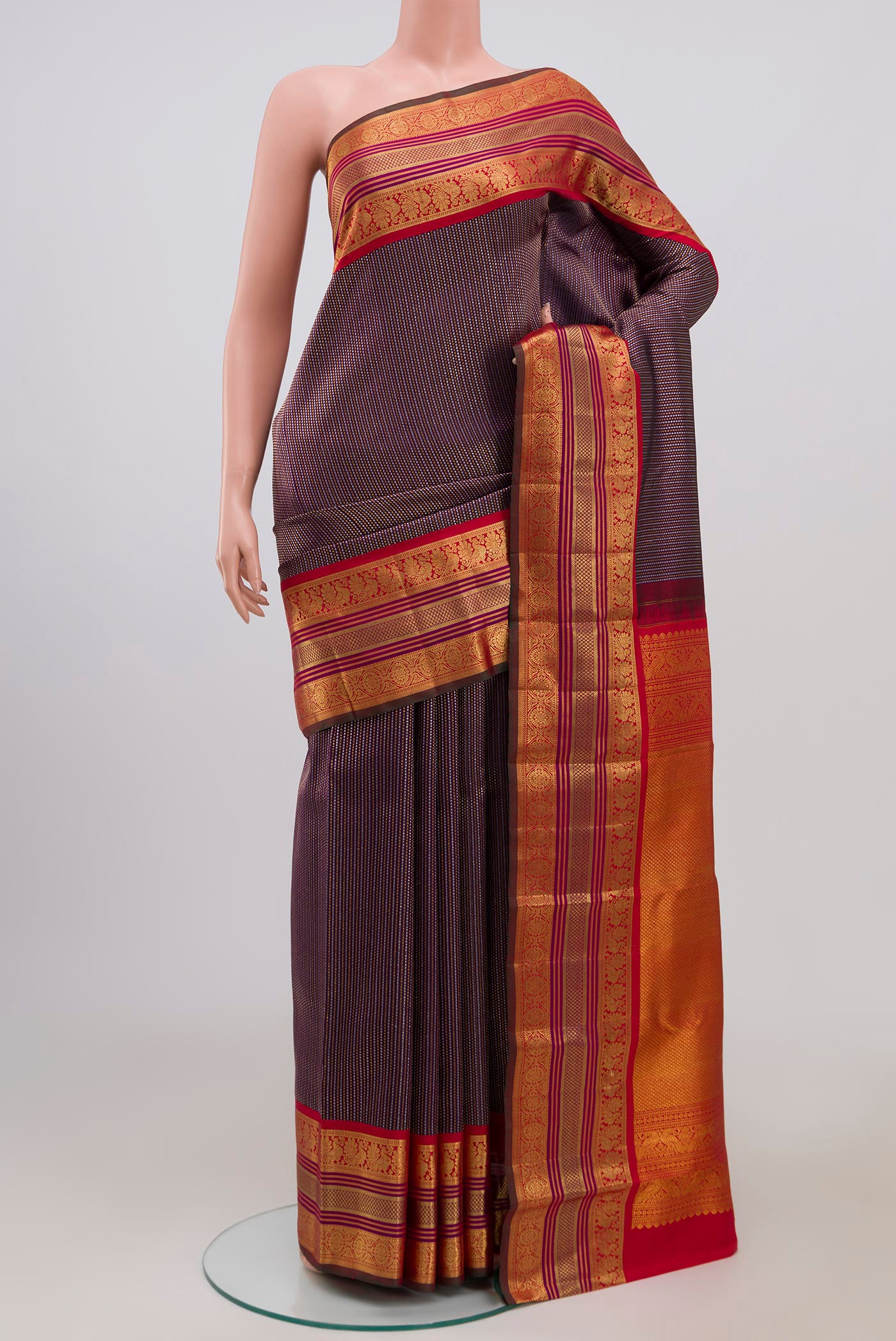 Purple Kanchipuram Saree with Zari Brocade on the body and Zari Border.  displayed on a mannequin