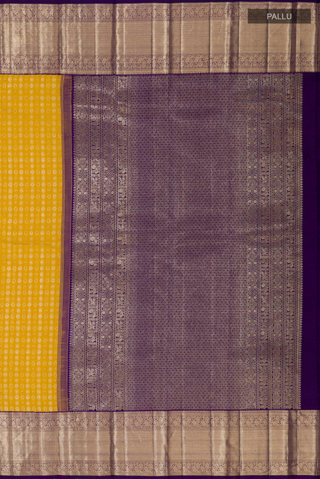 Close up image of the pallu of Yellow Kanchipuram Silk Saree with Zari Butta on the body and Zari Border. 