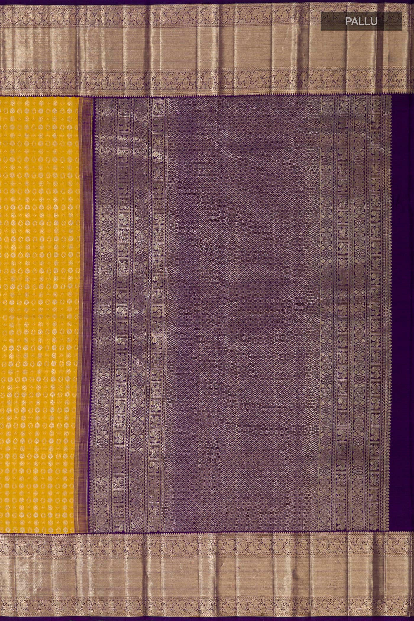 Close up image of the pallu of Yellow Kanchipuram Silk Saree with Zari Butta on the body and Zari Border. 