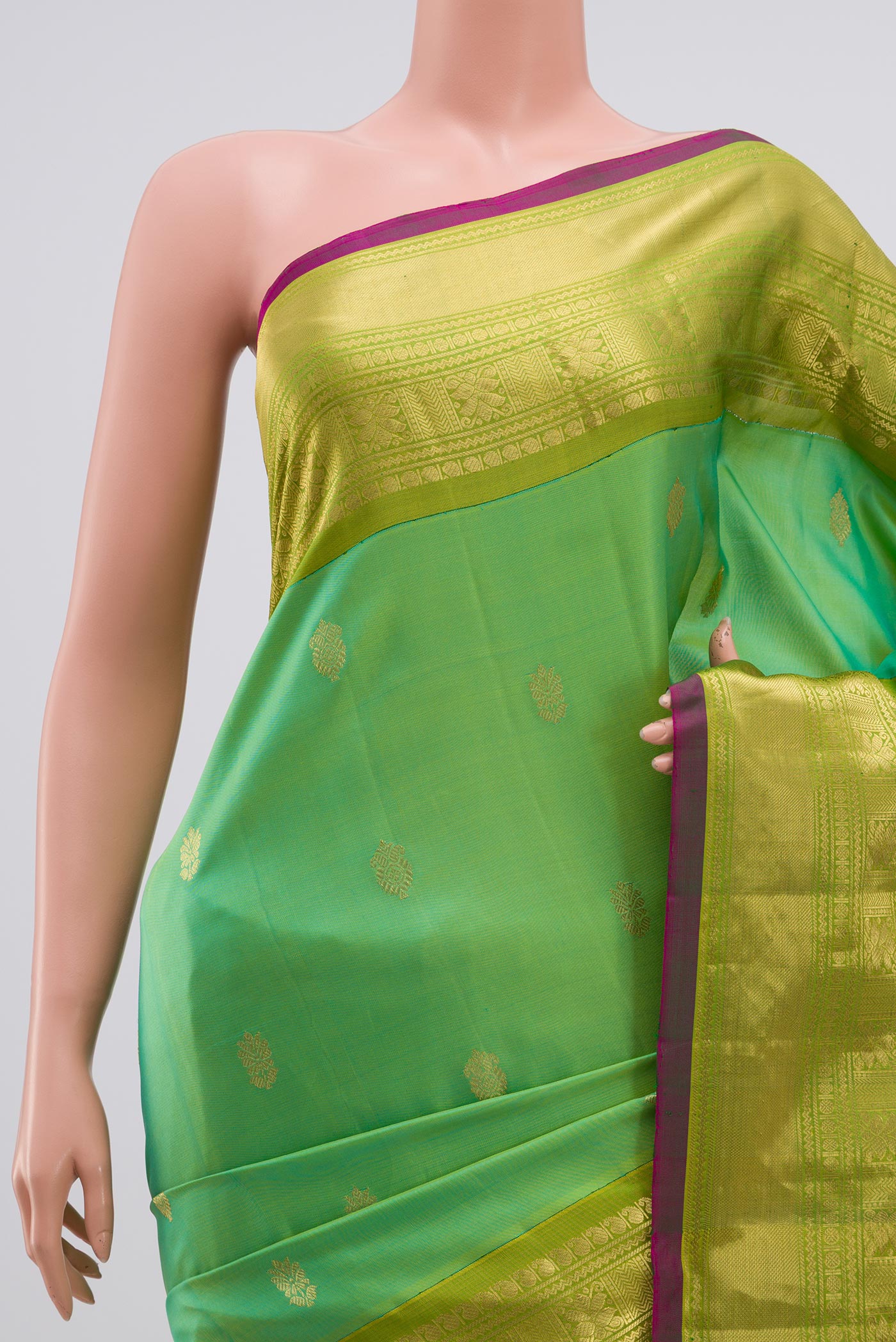 Border image of Green Gadwal Silk Saree with Zari Butta on the body and Zari Border. 