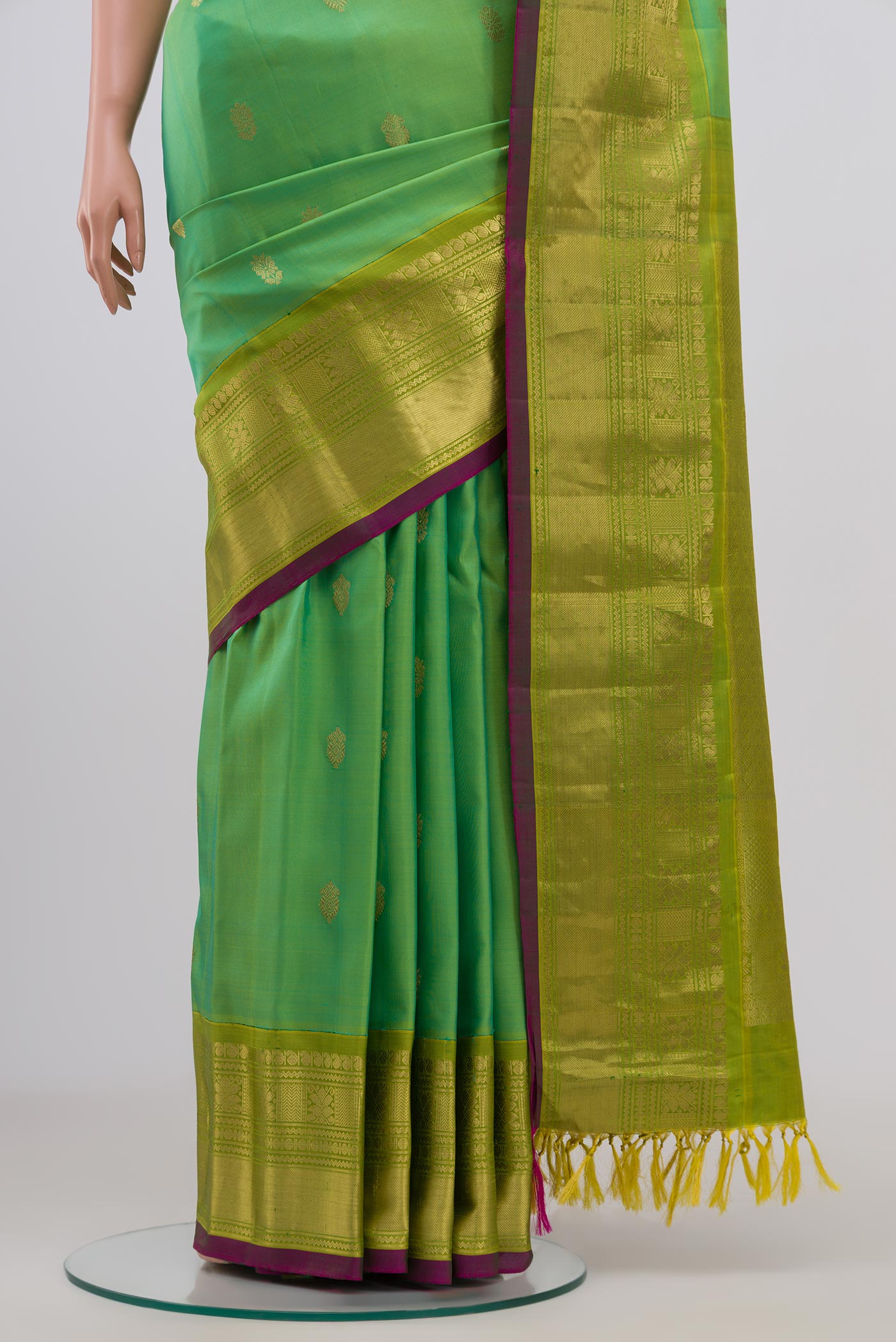 Pleats and pallu of Green Gadwal Silk Saree with Zari Butta on the body and Zari Border. 