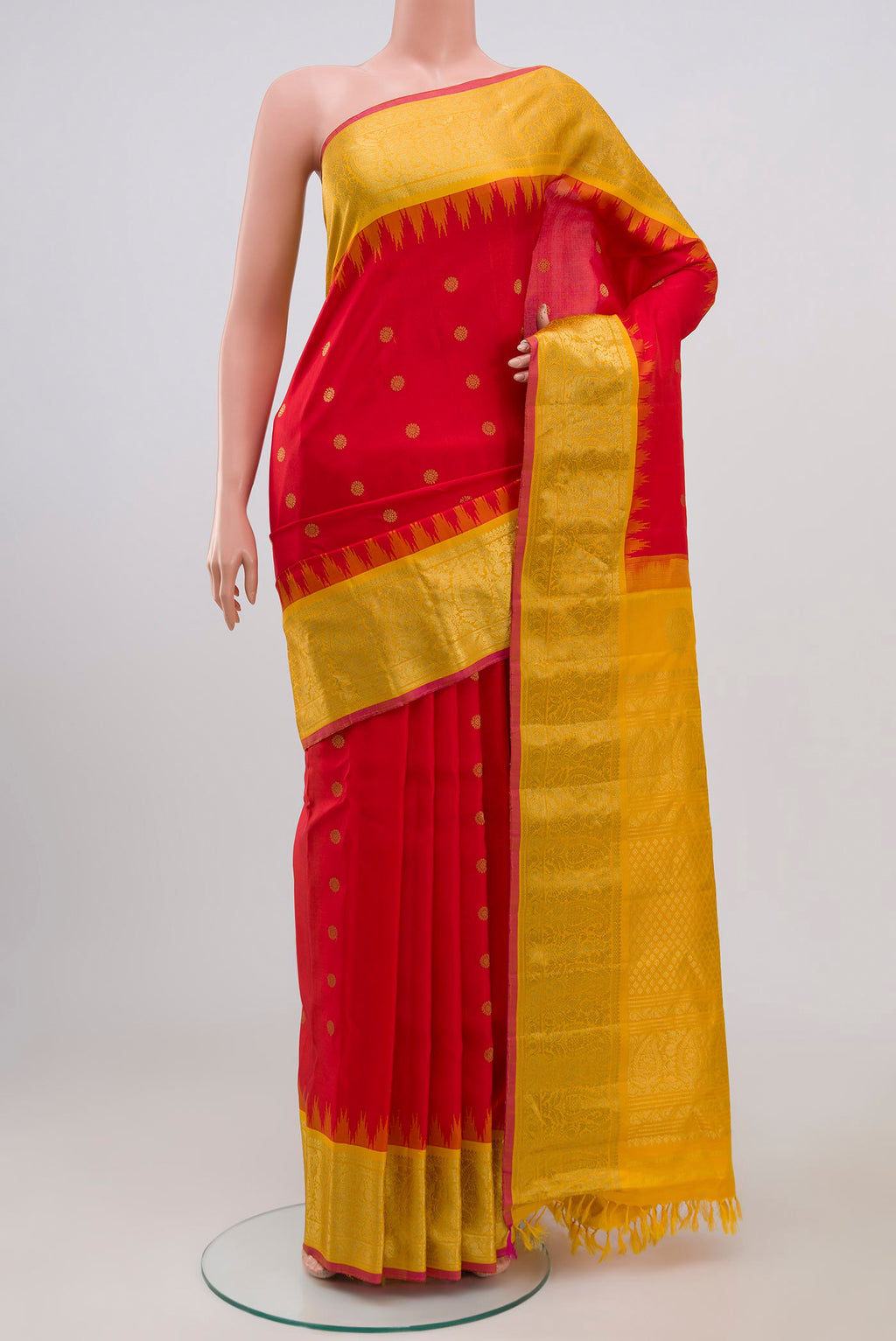 Red Gadwal Silk Saree with Zari Butta on the body and Zari Border.  displayed on a mannequin