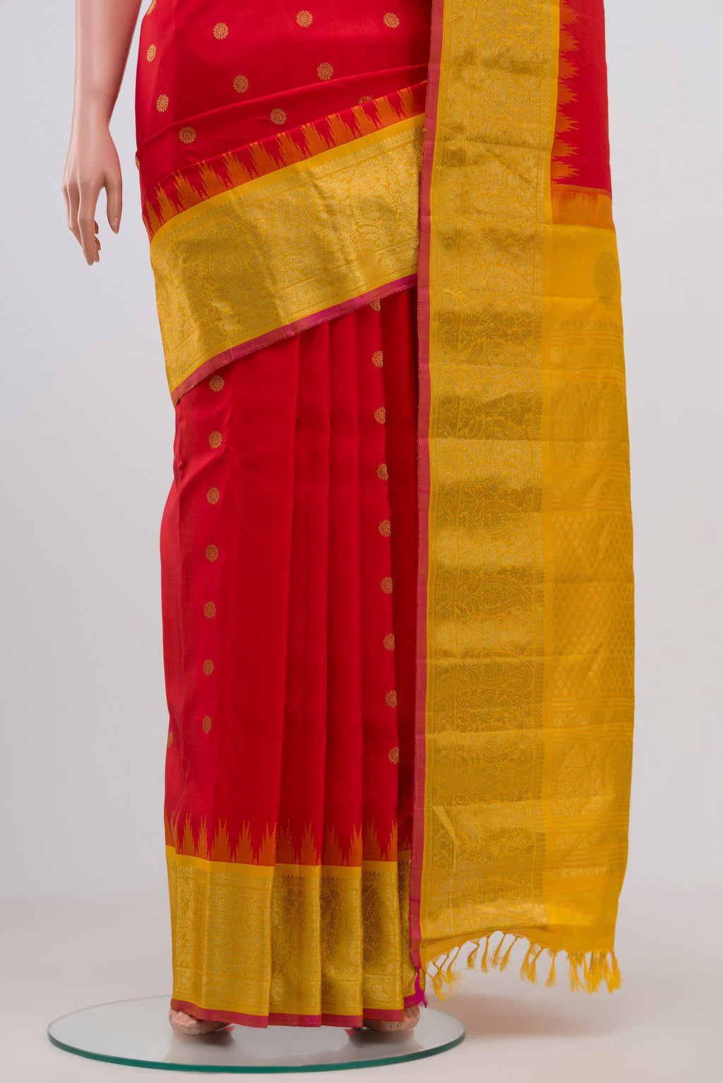 Pleats and pallu of Red Gadwal Silk Saree with Zari Butta on the body and Zari Border. 