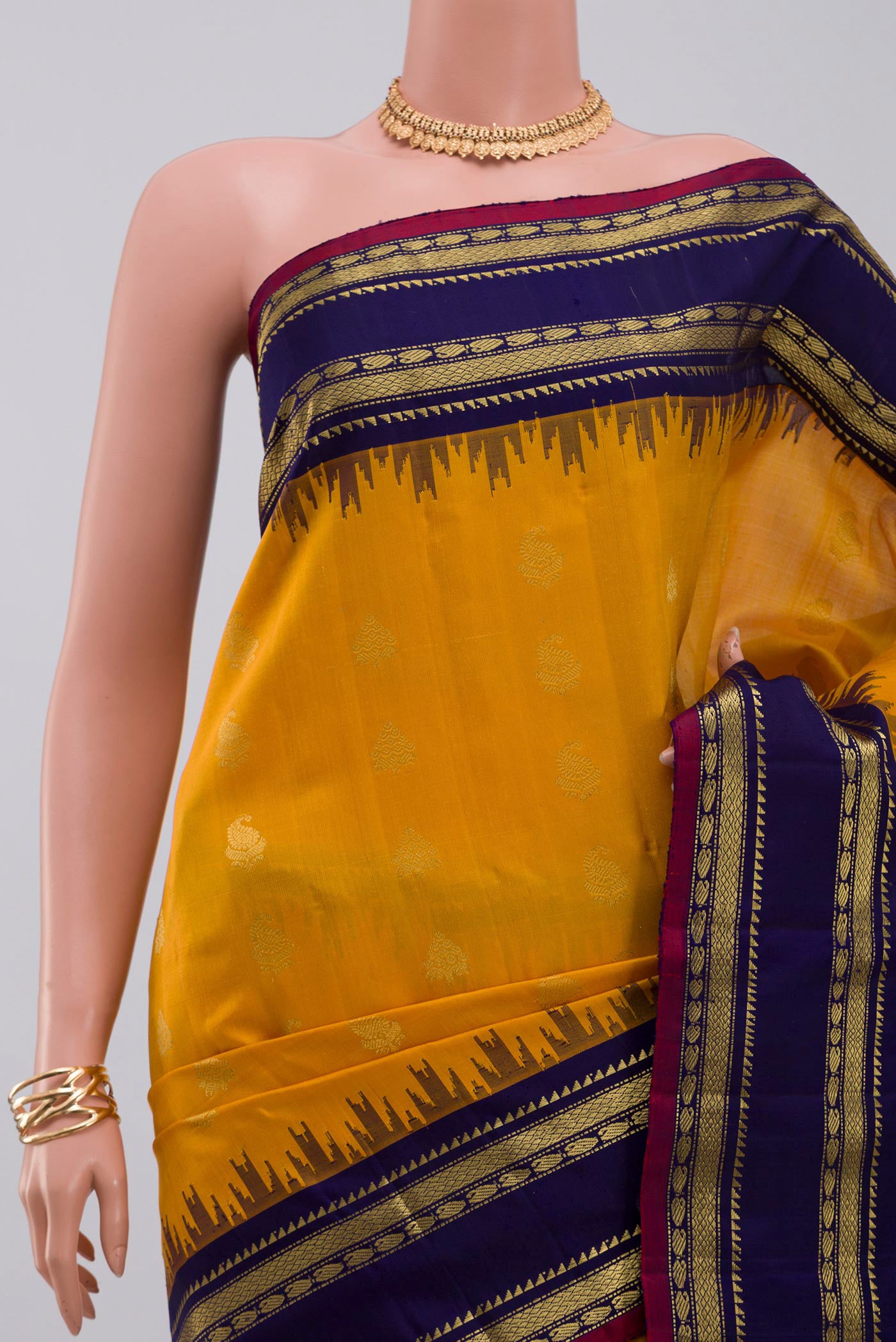Border image of Yellow Gadwal Silk Saree with Zari Butta on the body and Zari Border. 