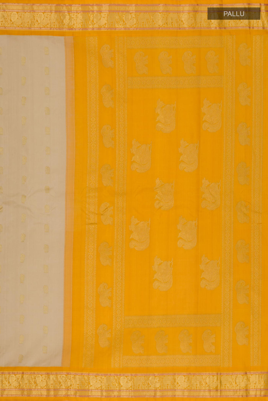 Close up image of the pallu of Cream Gadwal Silk Saree with Zari Butta on the body and Zari Border. 