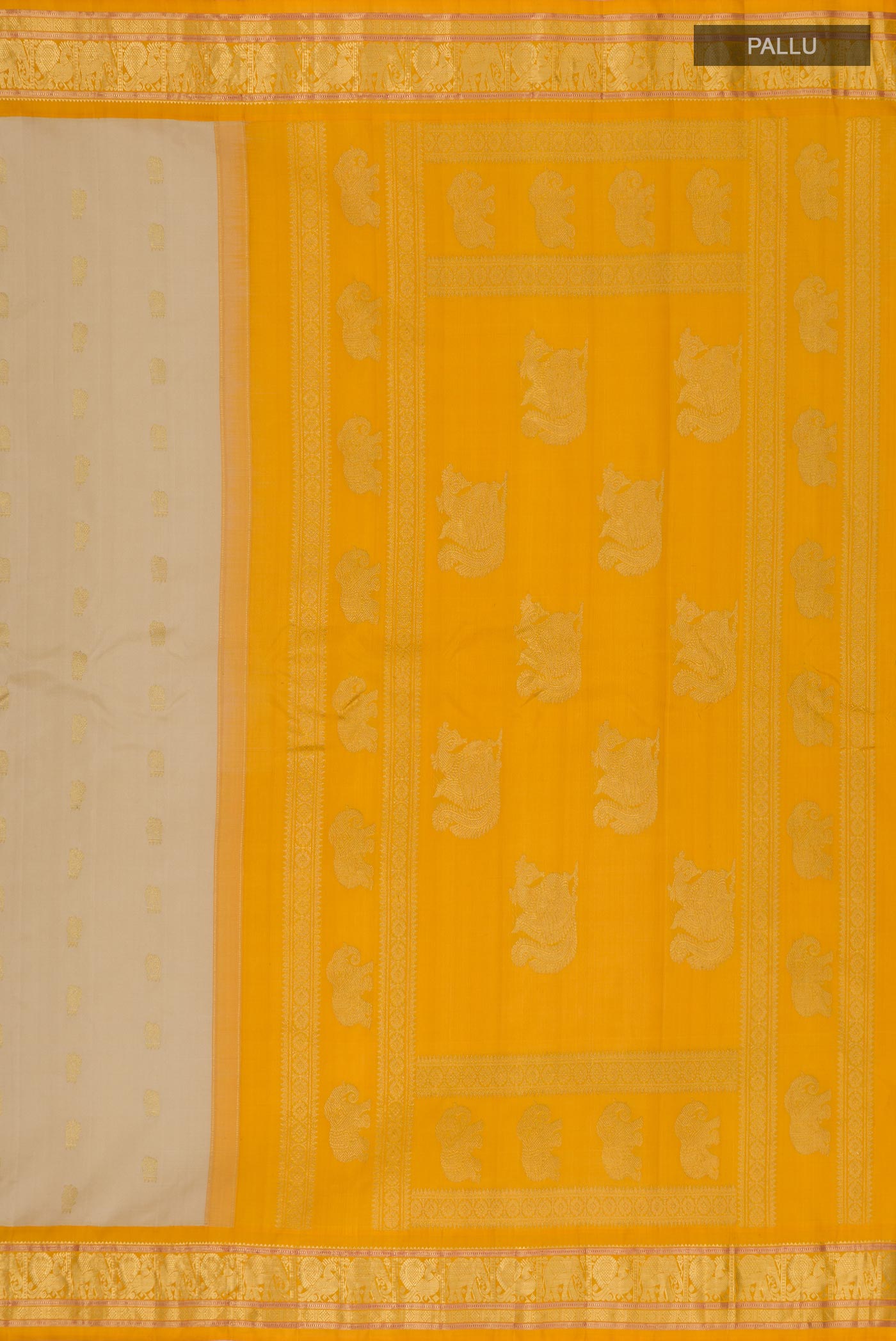 Close up image of the pallu of Cream Gadwal Silk Saree with Zari Butta on the body and Zari Border. 
