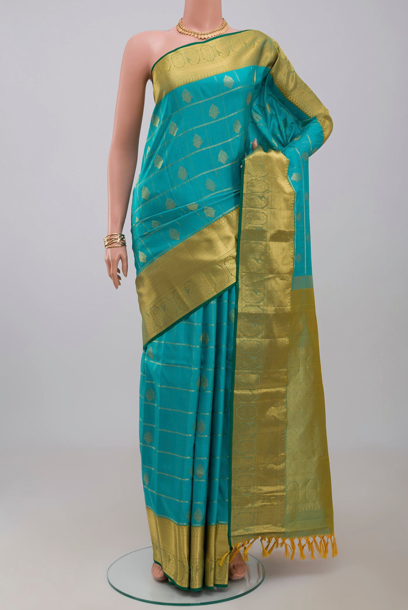 Blue Gadwal Silk Saree with Checked design on the body and Zari Border.  displayed on a mannequin