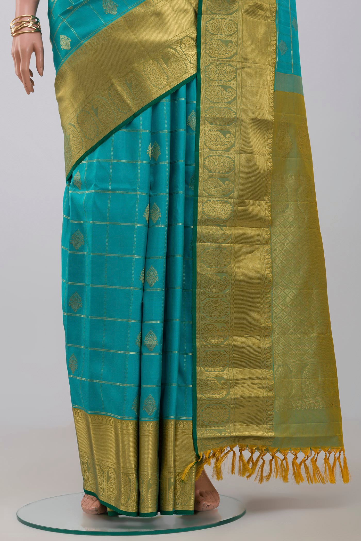 Pleats and pallu of Blue Gadwal Silk Saree with Checked design on the body and Zari Border. 