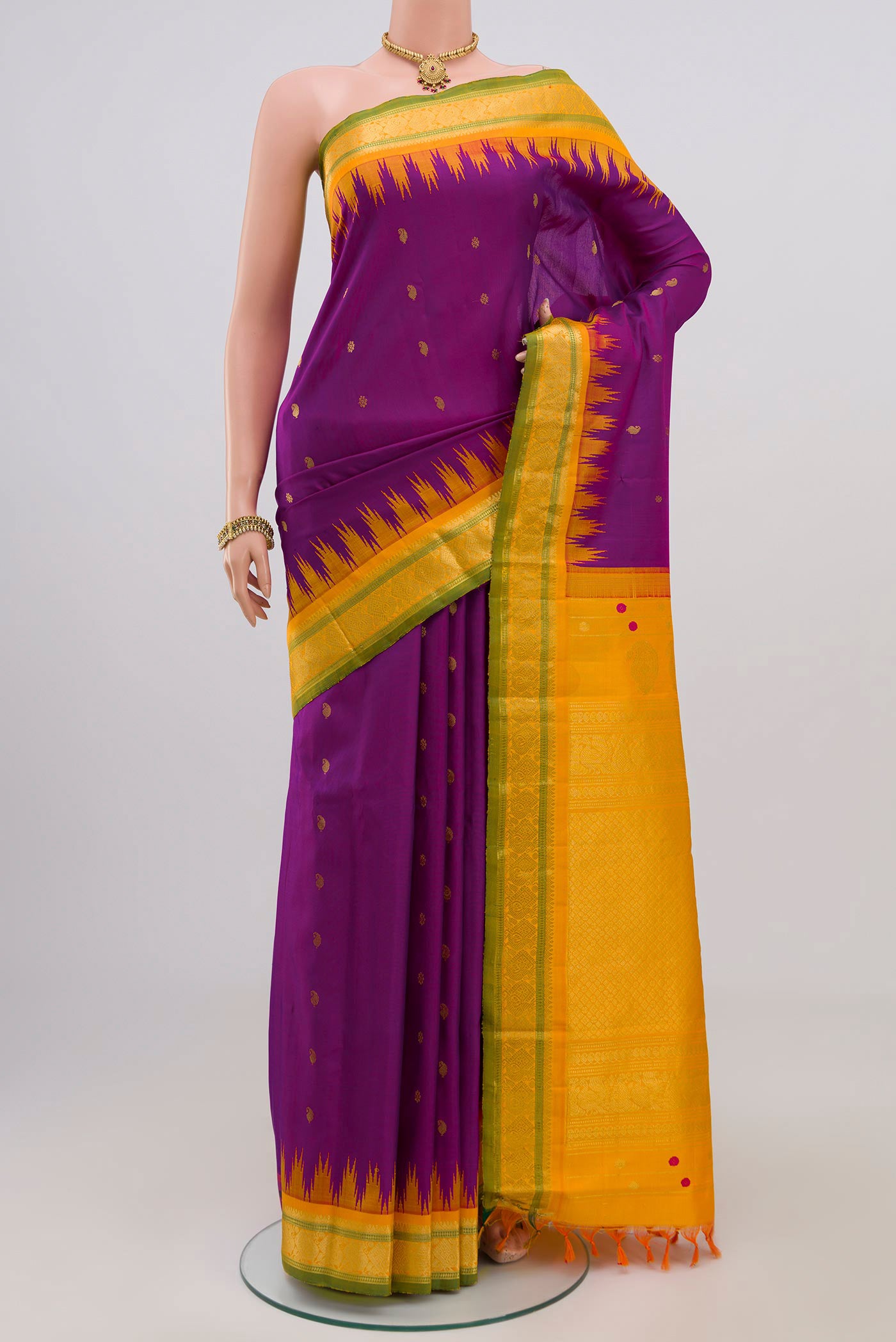 Purple Gadwal Silk Saree with Zari Butta on the body and Zari Border.  displayed on a mannequin