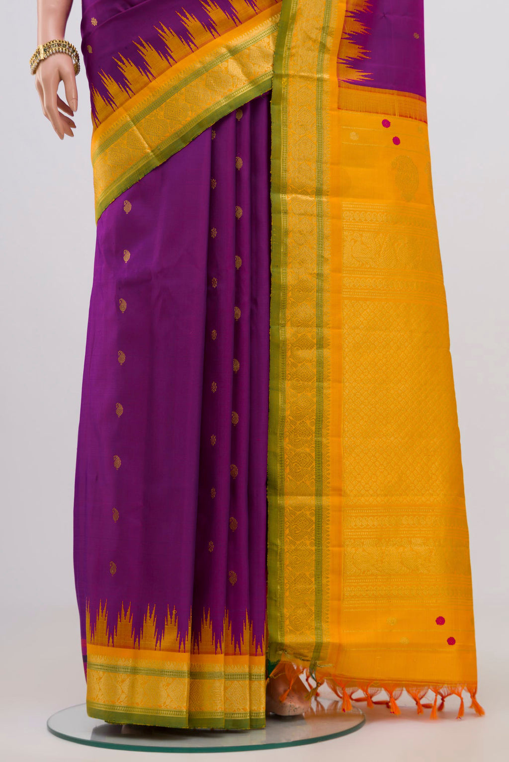 Pleats and pallu of Purple Gadwal Silk Saree with Zari Butta on the body and Zari Border. 