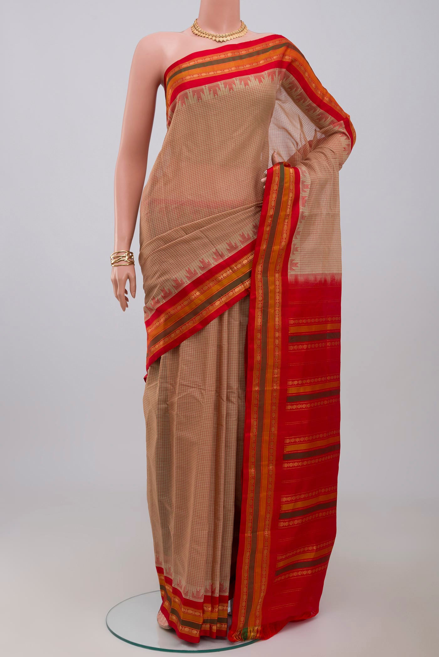 Cream Gadwal Silk Cotton Saree with Checked design on the body and Zari Border.  displayed on a mannequin