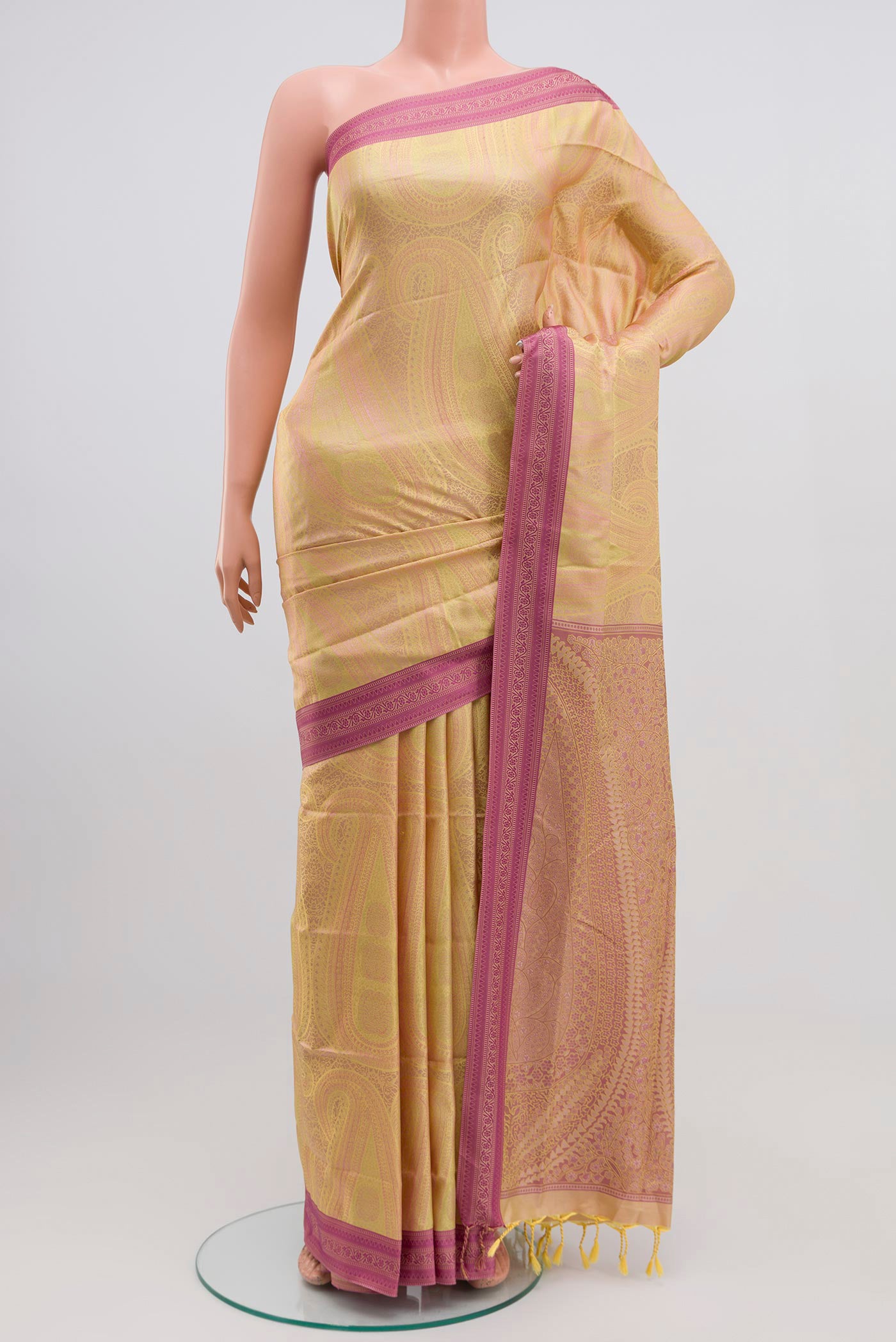 Yellow Soft Silk Saree with Jacquard design on the body and Thread Border.  displayed on a mannequin