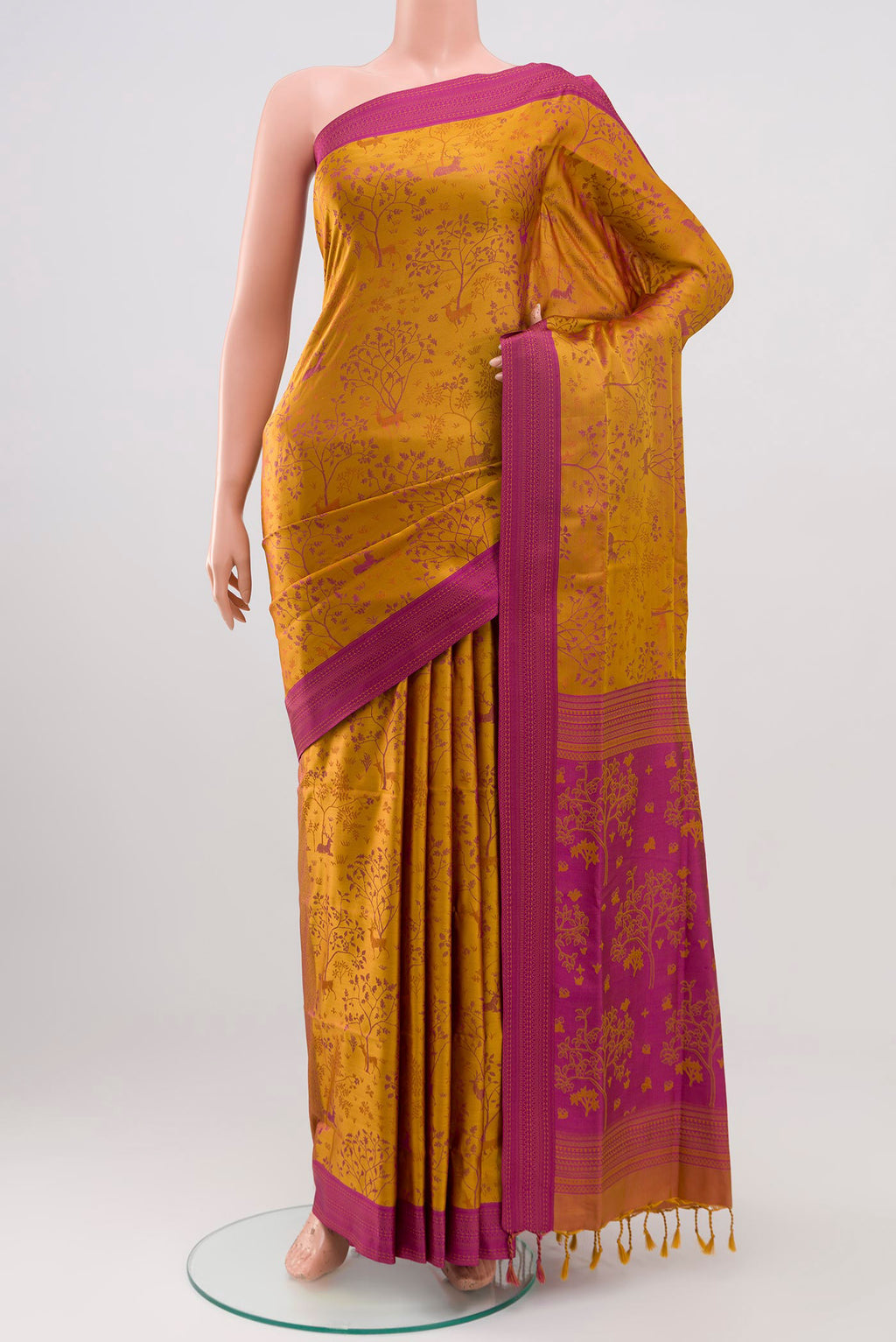 Mustard Soft Silk Saree with Jacquard design on the body and Thread Border.  displayed on a mannequin
