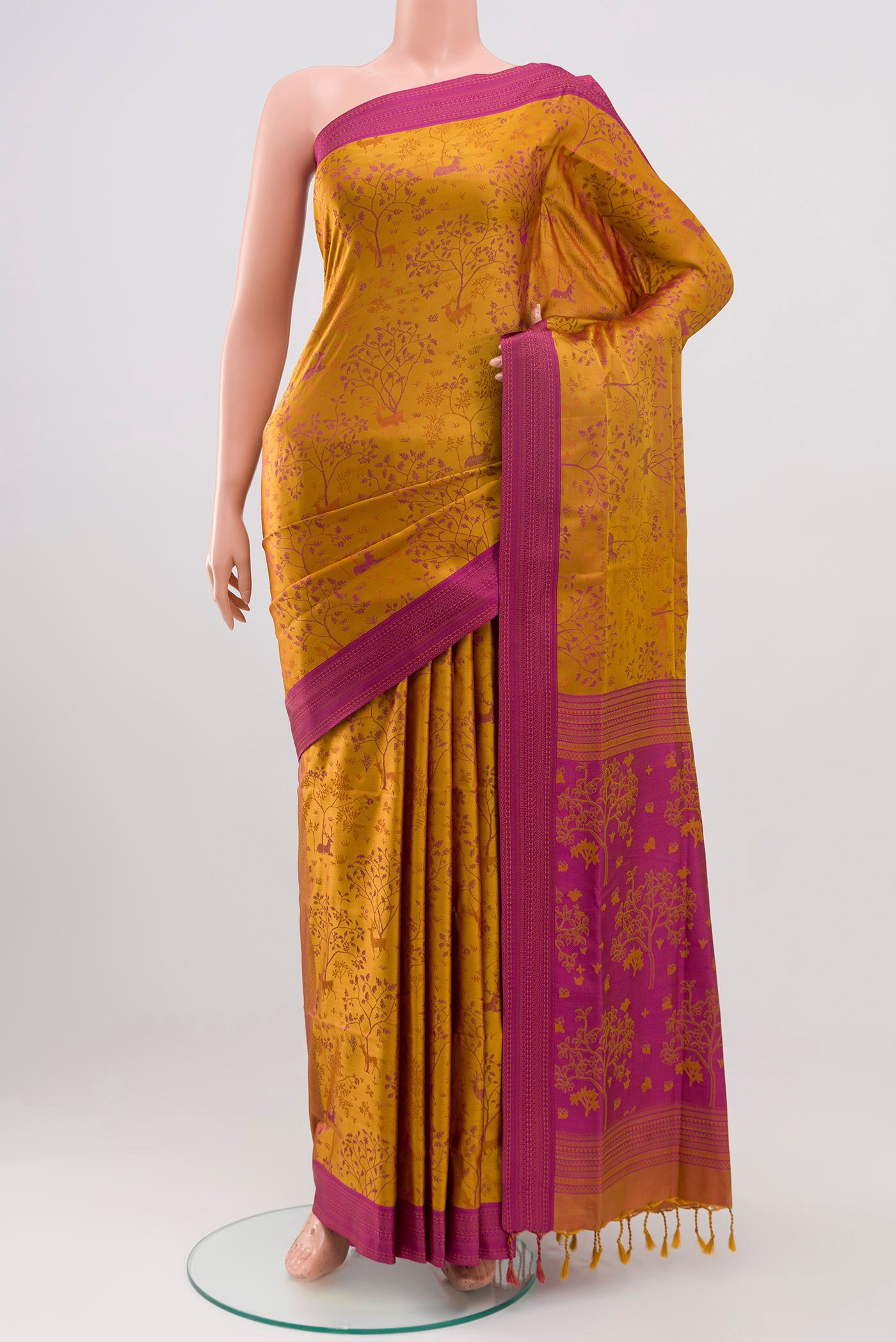 Mustard Soft Silk Saree with Jacquard design on the body and Thread Border.  displayed on a mannequin