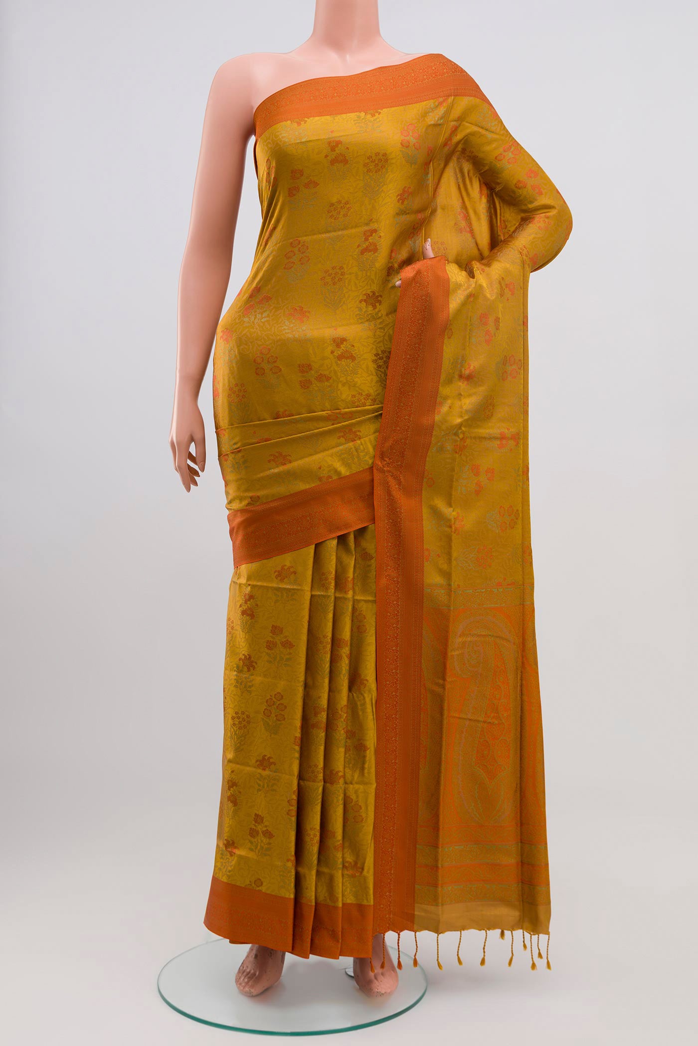 Mustard Soft Silk Saree with Jacquard design on the body and Thread Border.  displayed on a mannequin