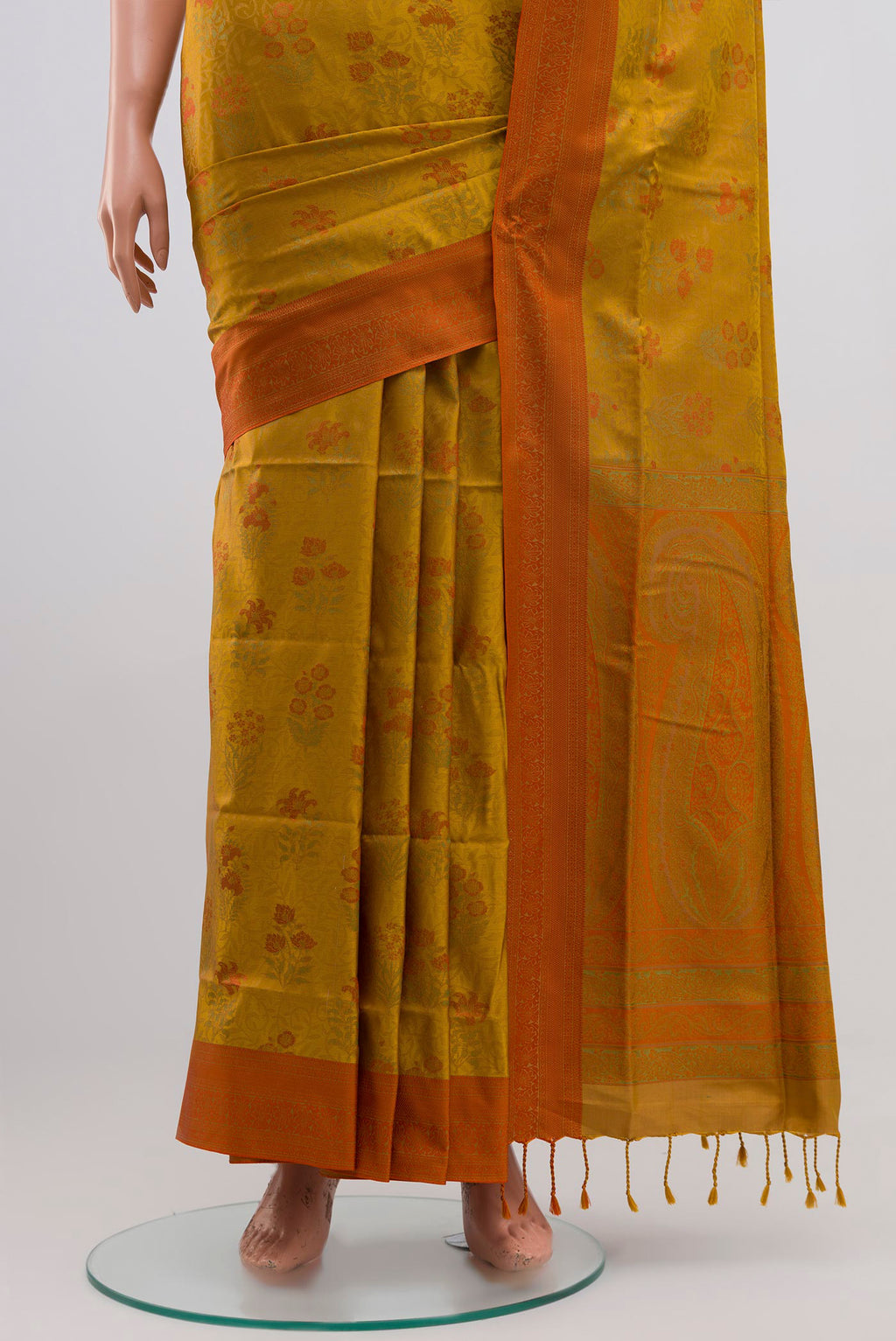 Pleats and pallu of Mustard Soft Silk Saree with Jacquard design on the body and Thread Border. 